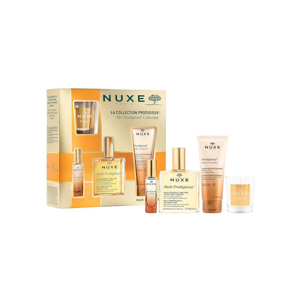 Coffret cadeau Nuxe. Contient huile, gel douche, bougie et autres produits. Doré.