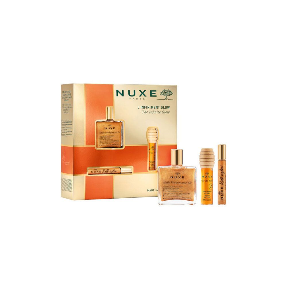 Coffret cadeau avec trois produits. Emballage doré-orangé avec produits et texte Nuxe L'Infiniment Glow. Deux produits à l'extérieur.