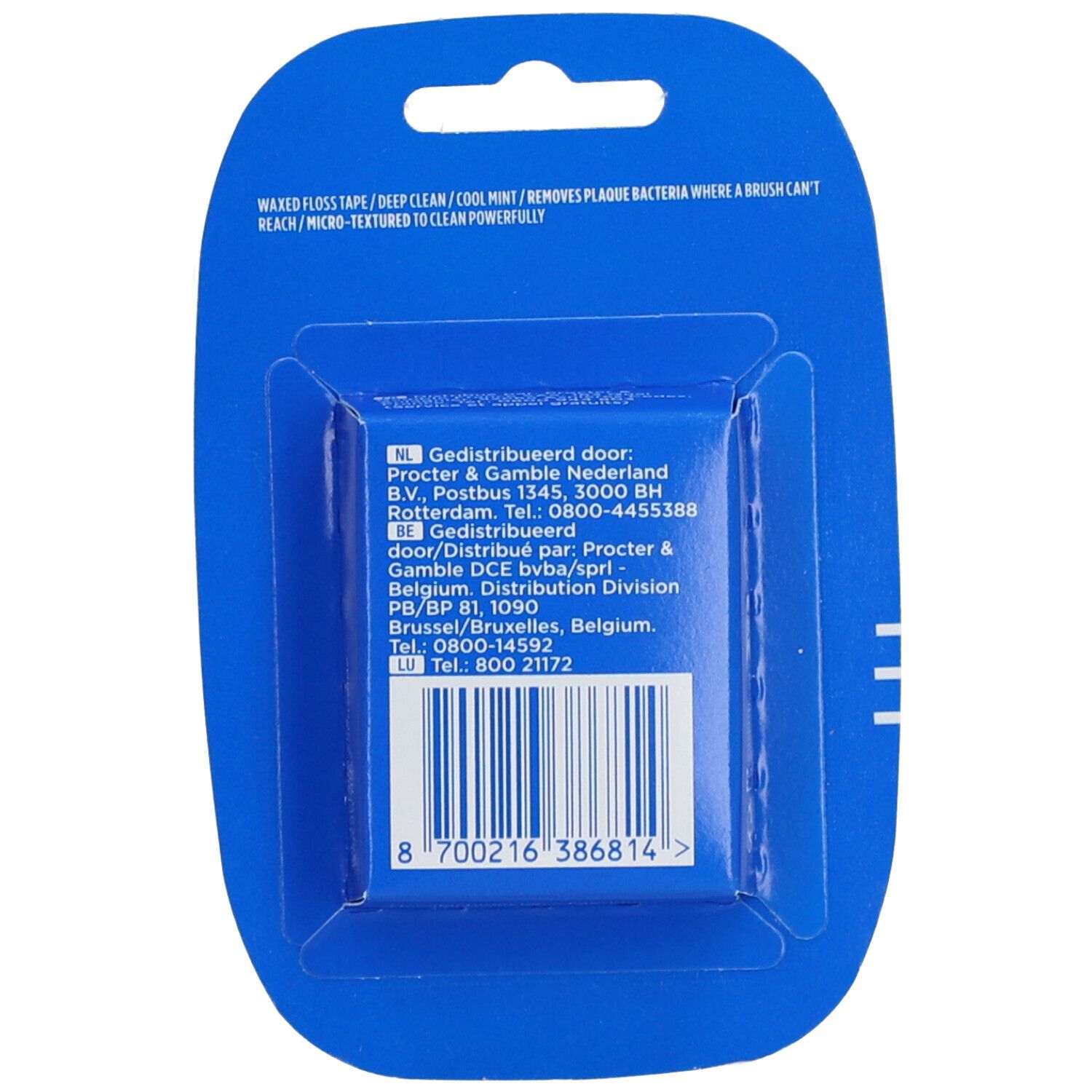 Rückseite der Zahnseide-Packung. Text und Barcode auf blauem Hintergrund. Herstellerinformationen.