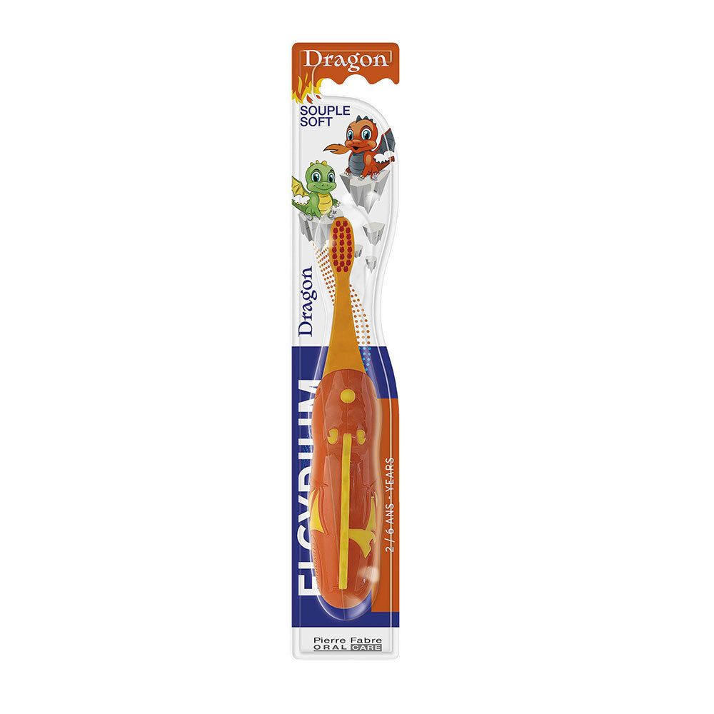 Orangefarbene Kinderzahnbürste mit Drachenmotiv. Weiche Borsten, Griff mit gelben Akzenten. Verpackung mit Produktnamen und Altersempfehlung.