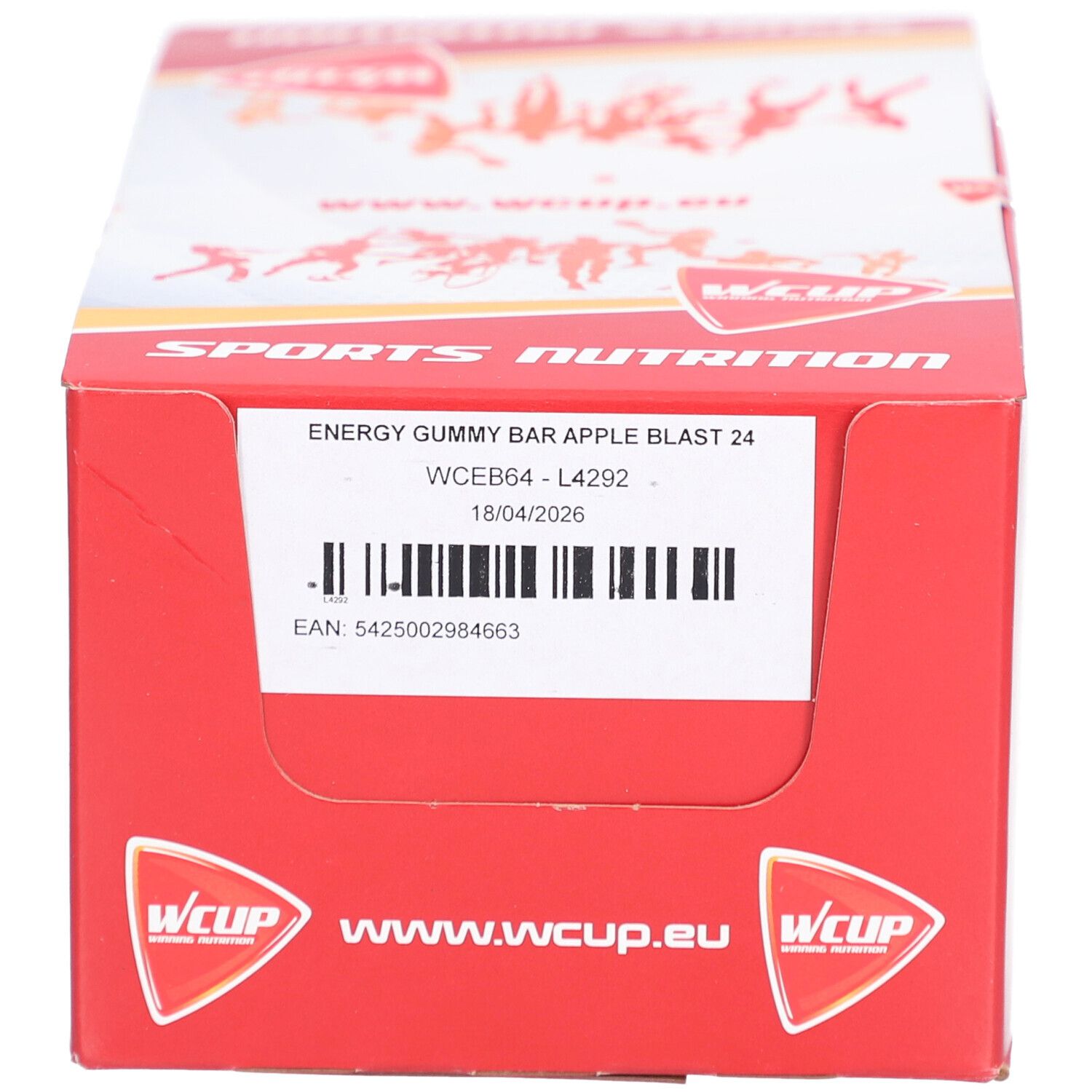 Boîte rouge avec texte blanc "SPORTS NUTRITION" et "WCUP". Contient "ENERGY GUMMY BAR APPLE BLAST".