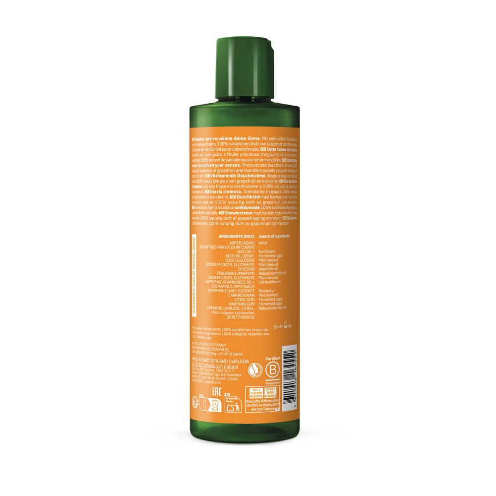 Flacon vert avec étiquette orange. Texte multilingue. Liste des ingrédients. Certifications.