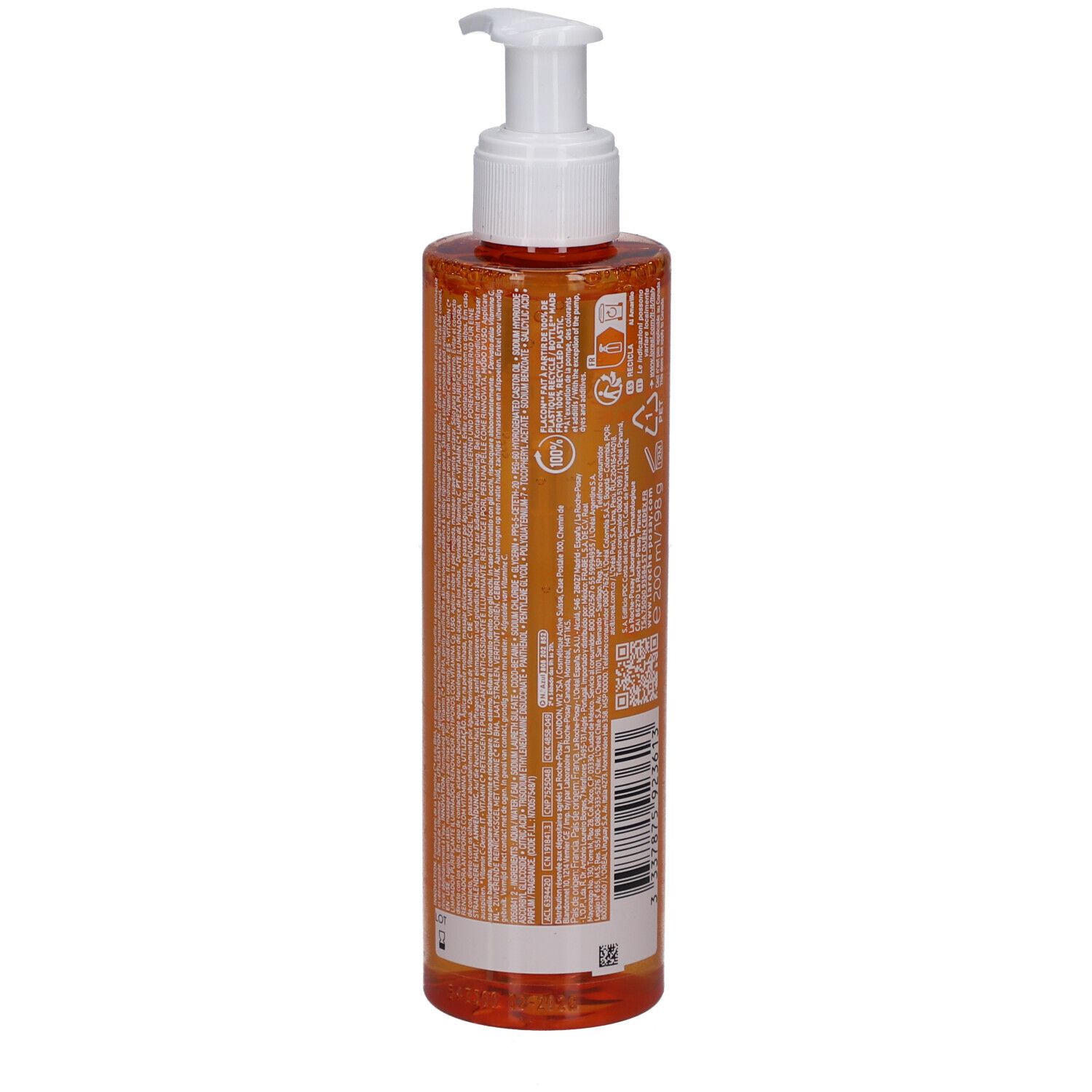 Orangefarbene Flüssigkeit in einer transparenten Pumpflasche mit weißem Spender.