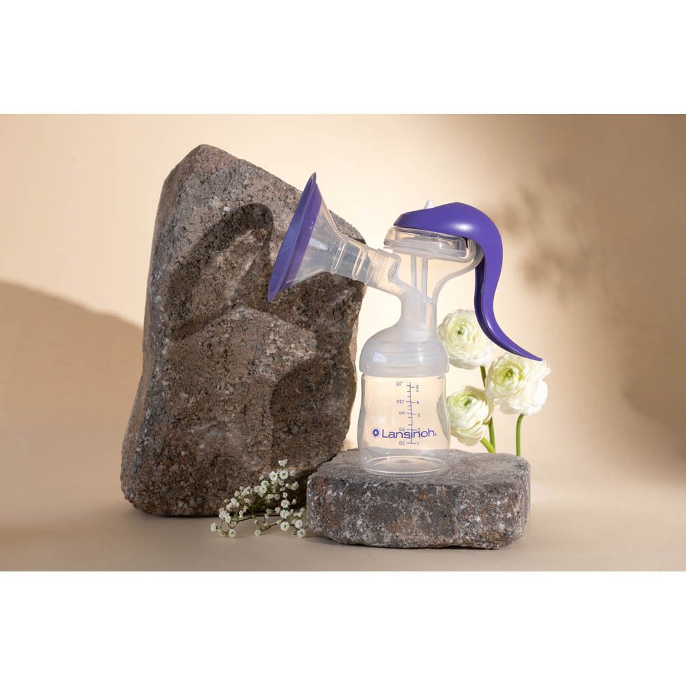 Tire-lait manuel. Marque Lansinoh. Violet et blanc.