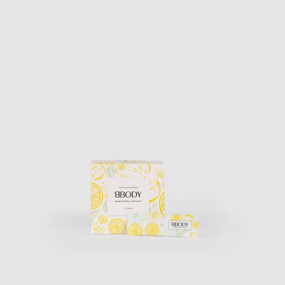 Doos BBODY Electrolyte Mix. Geel-wit ontwerp met citroen- en bladmotieven. Product en zakje.
