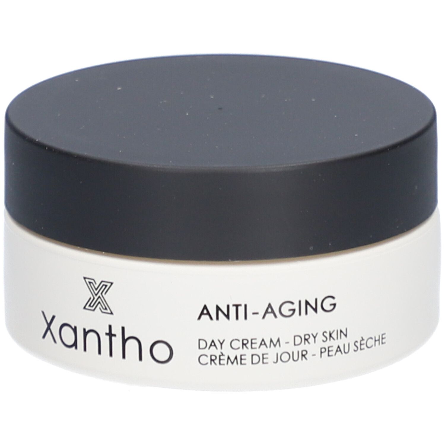Cremebehälter mit schwarzem Deckel. Aufschrift: Xantho, Anti-Aging, Day Cream - Dry Skin, Crème de Jour - Peau Sèche.