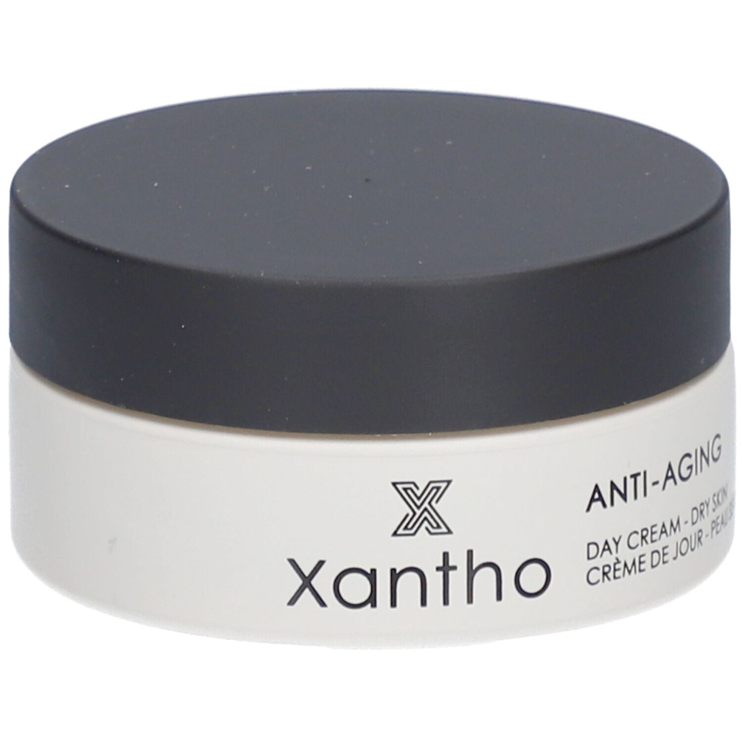 Cremebehälter mit schwarzem Deckel. Aufschrift: Xantho, Anti-Aging, Day Cream - Dry Skin, Crème de Jour - Peau Sèche.