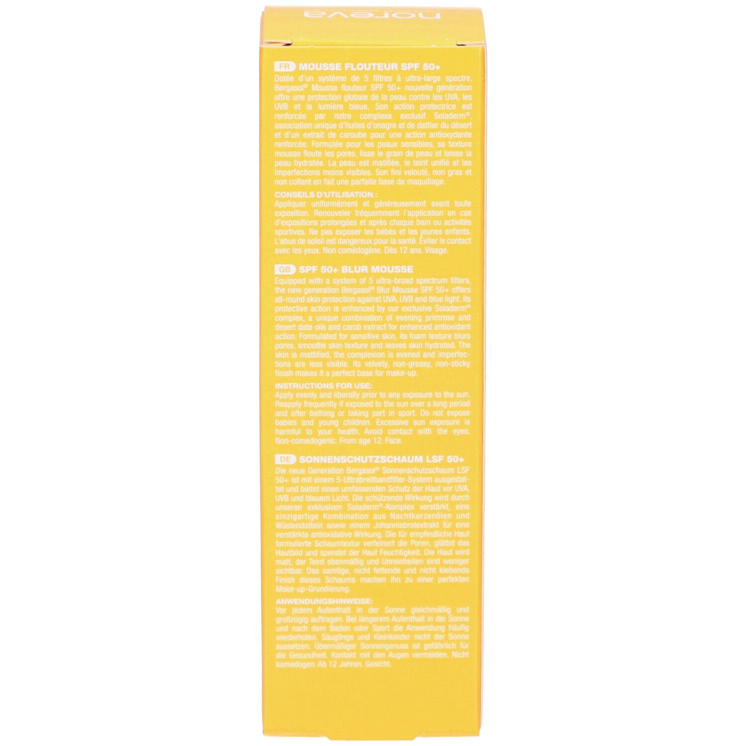 Seite einer gelben Schachtel. Text in mehreren Sprachen. Aufschrift: Mousse Flouteur SPF 50+, Blurring Mousse SPF 50+, Sonnenschutzschaum LSF50+.