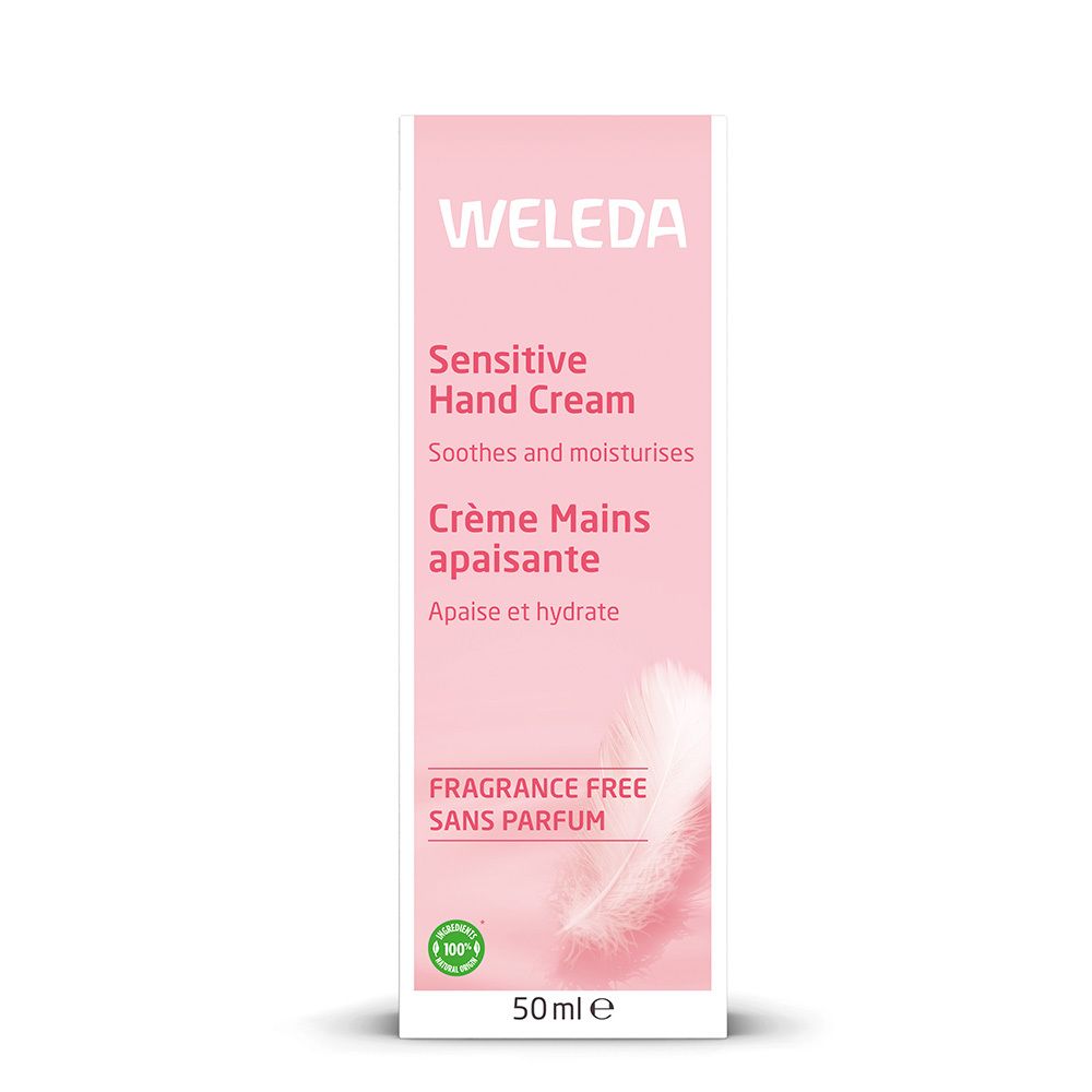 Roze doos. Opschrift: Weleda, Sensitive Hand Cream, Crème Mains apaisante, Fragrance Free, 50ml, logo.