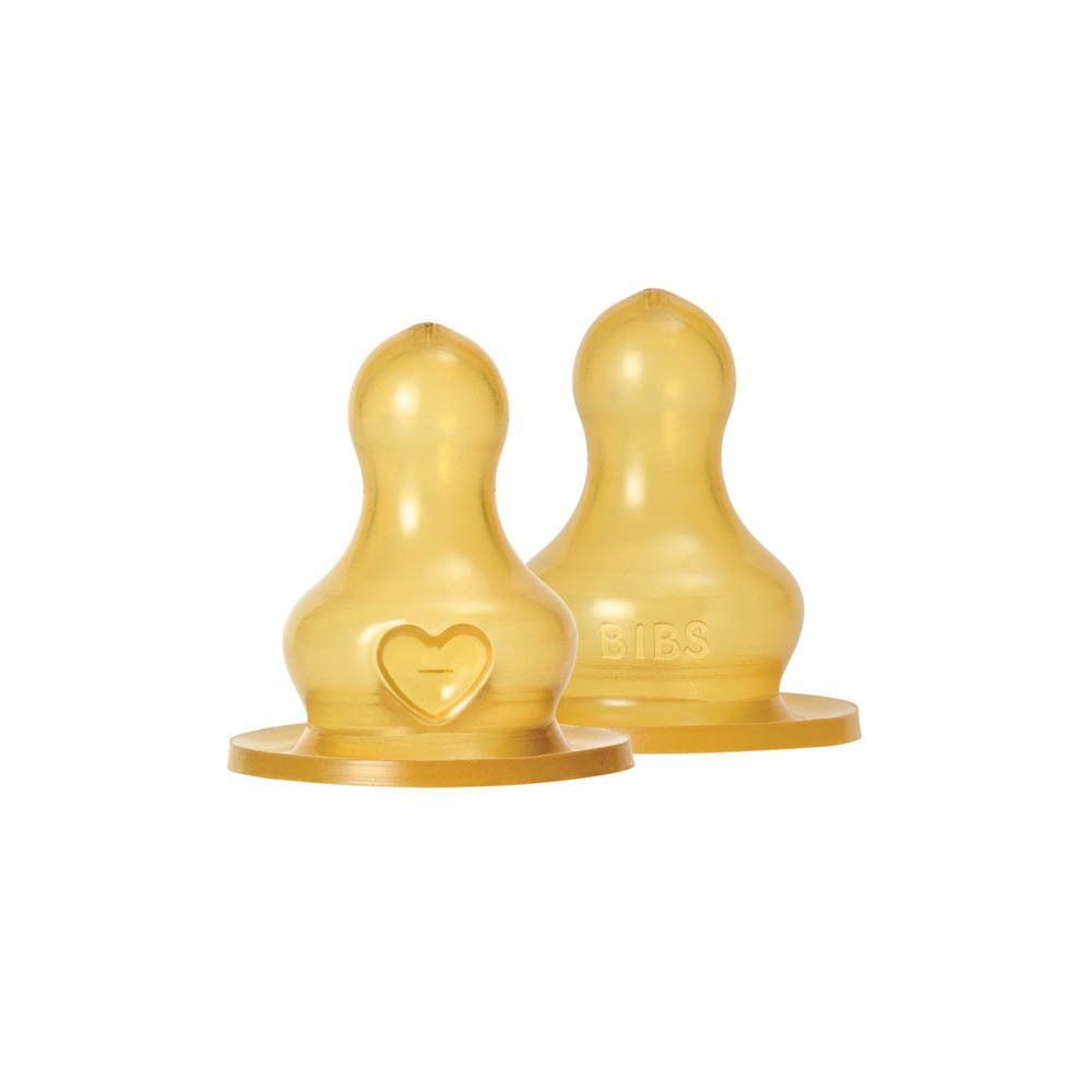 Deux tétines BIBS en latex naturel. Forme ronde, motif cœur. Prix: Red Dot Winner.