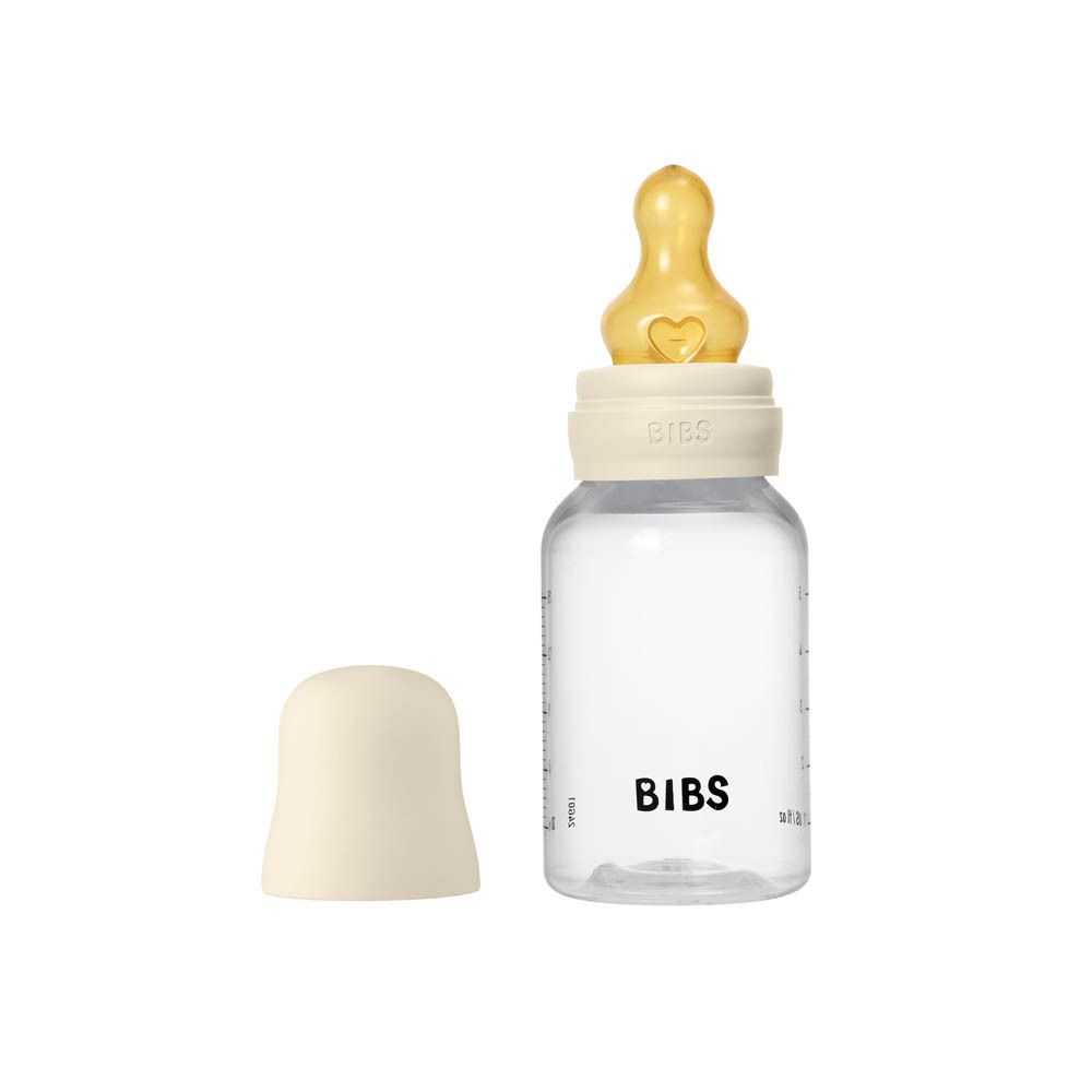 Biberon avec tétine. Tétine ivoire sur la bouteille. Logo BIBS.