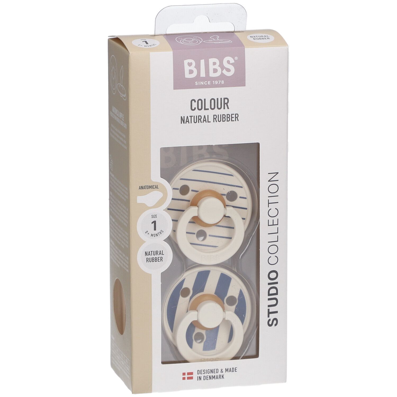 Verpackung mit zwei Schnullern. BIBS-Logo, 'COLOUR', 'NATURAL RUBBER'. Zwei Schnuller mit blau-weißem Streifenmuster.