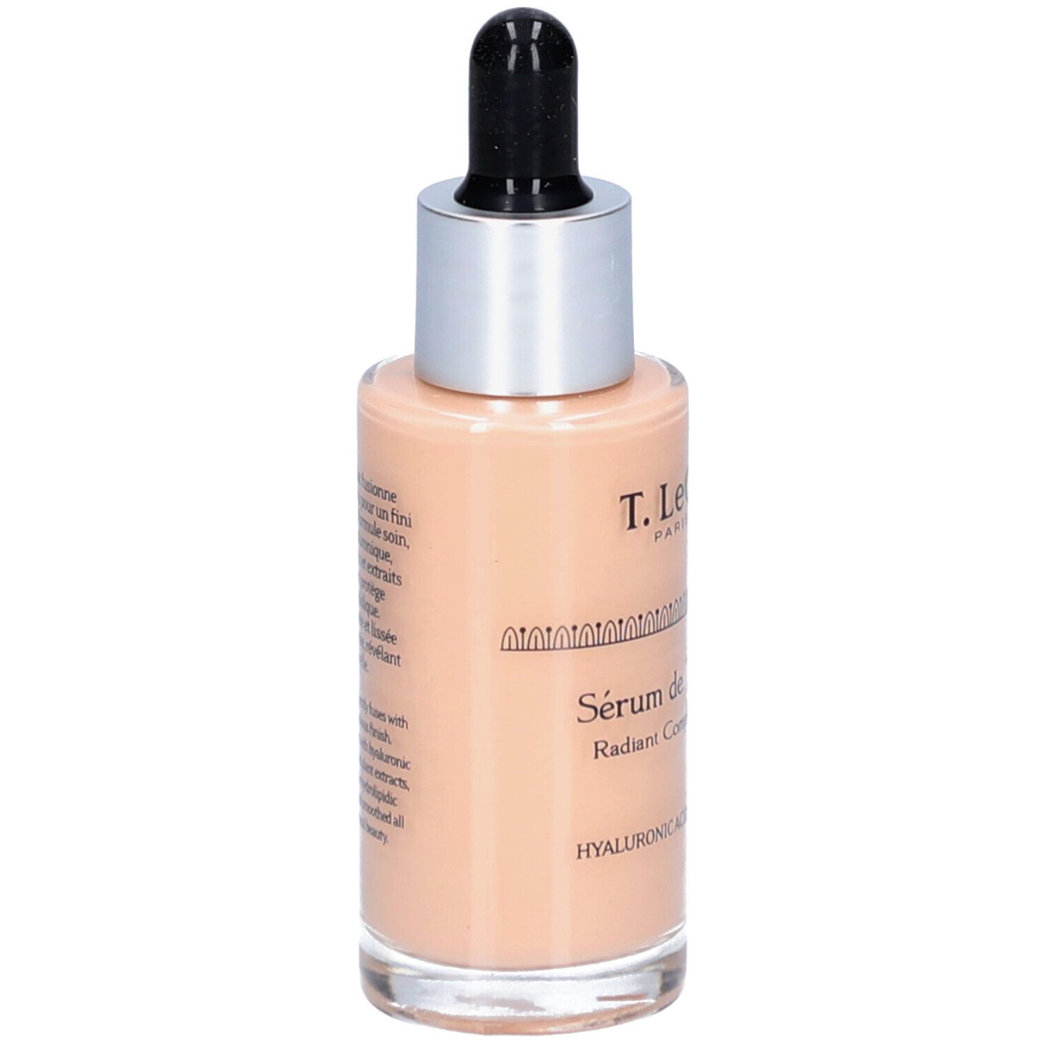 T.LeClerc Serumflasche. Beige Flüssigkeit, silberner Deckel, schwarze Pipette. Beschriftung: Sérum de Teint Éclat, Radiant Complexion Serum.