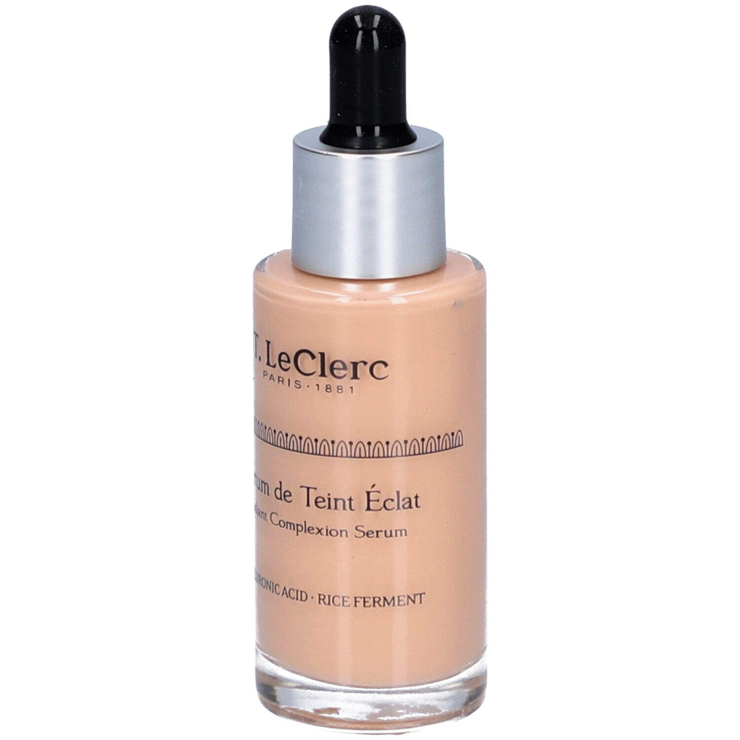 T.LeClerc Serumflasche. Beige Flüssigkeit, silberner Deckel, schwarze Pipette. Beschriftung: Sérum de Teint Éclat, Radiant Complexion Serum.