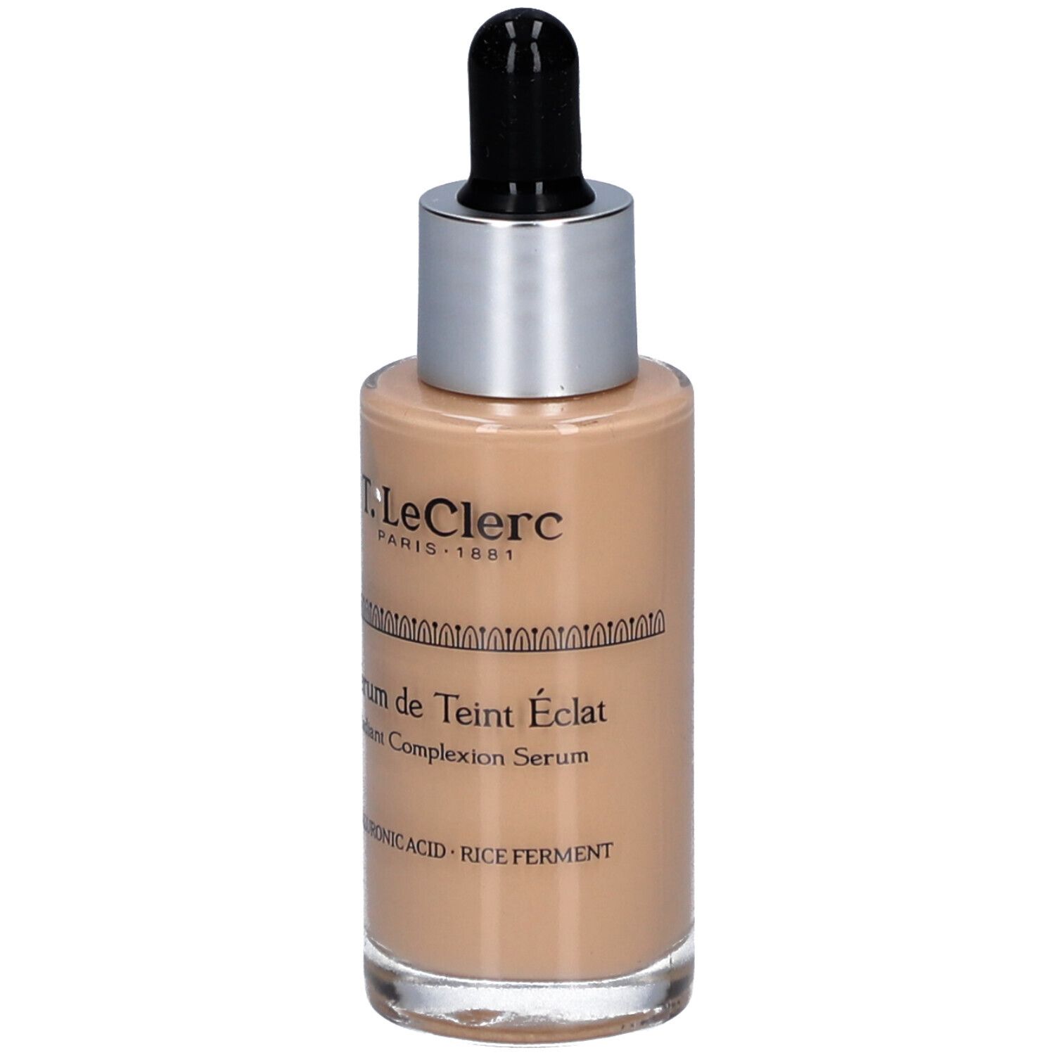 T.LeClerc Serumflasche. Beige Flüssigkeit, silberner Deckel, schwarze Pipette. Text: Sérum de Teint Éclat.
