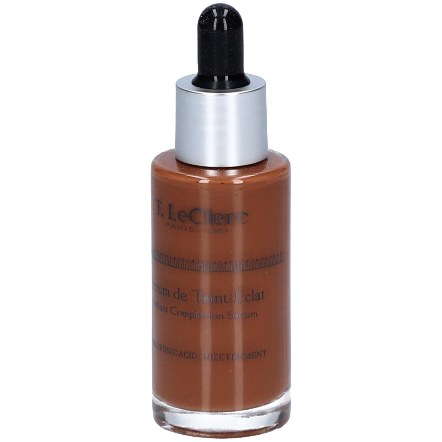 Braune Serumflasche mit silbernem Deckel und schwarzer Pipette. Beschriftung: T. LeClerc, Sérum de Teint Éclat, Radiant Complexion Serum.