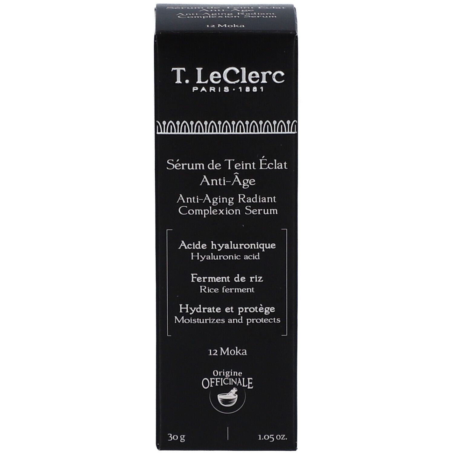 Schwarze Verpackung mit Produktnamen und Inhaltsstoffen. Produktname: T. LeClerc Sérum de Teint Éclat Anti-Âge. Inhaltsstoffe: Hyaluronsäure, Reisferment.