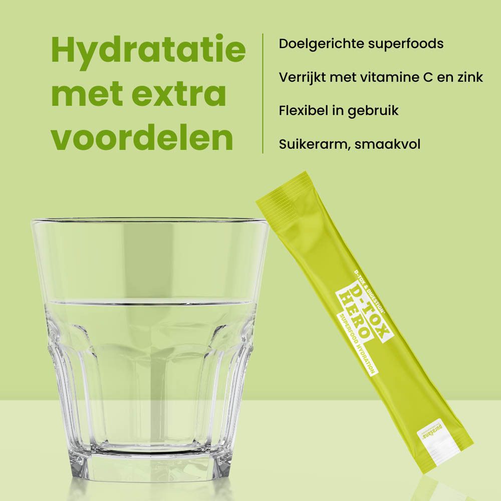 Groene doos met product. Opschrift: D-Tox Hero, Superfood Hydration. 10 sticks. Ingrediënten: Gember, Kurkuma, Enzymen, Vitamine C.