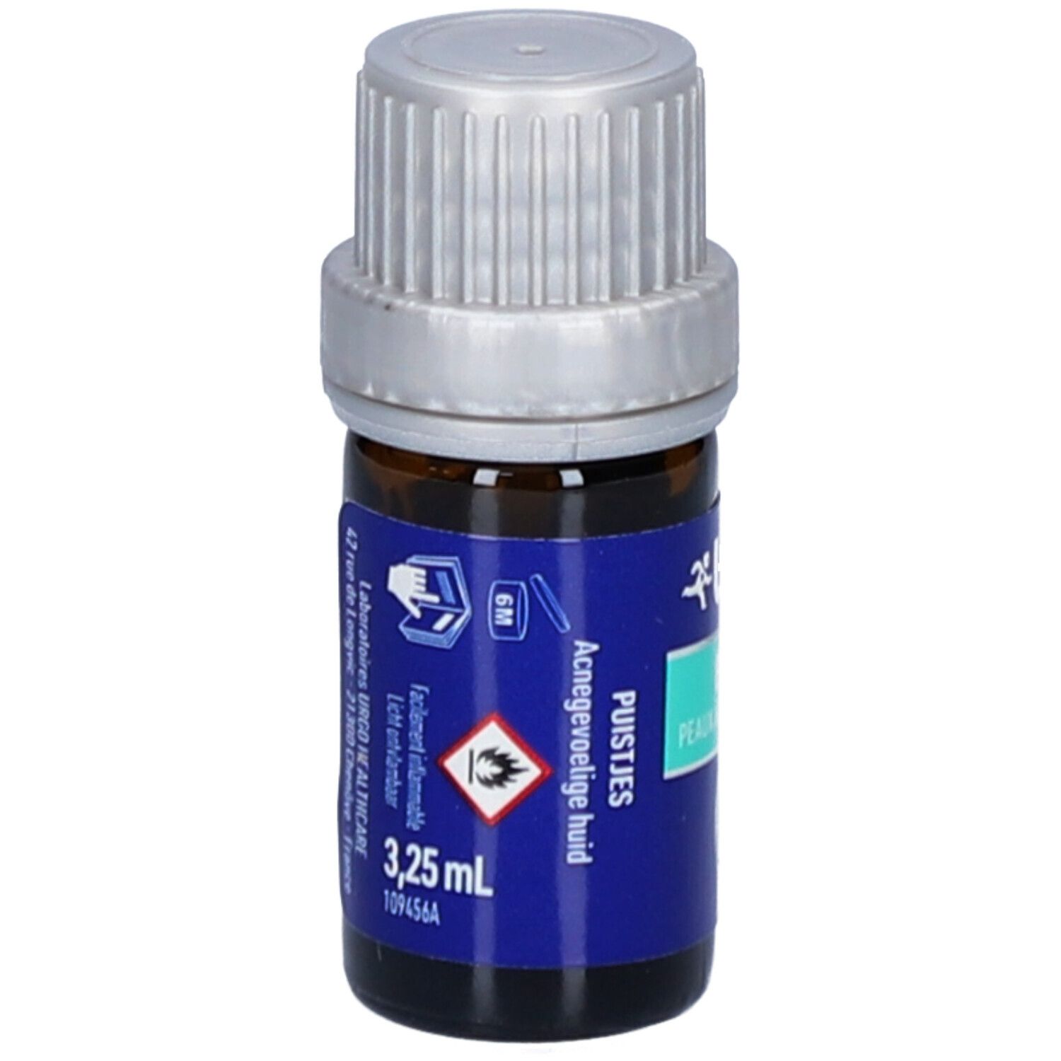 Braune Glasflasche mit silbernem Deckel. Blaues Etikett mit Text: URGO, 3,25 ml, Acnégevoelige huid.