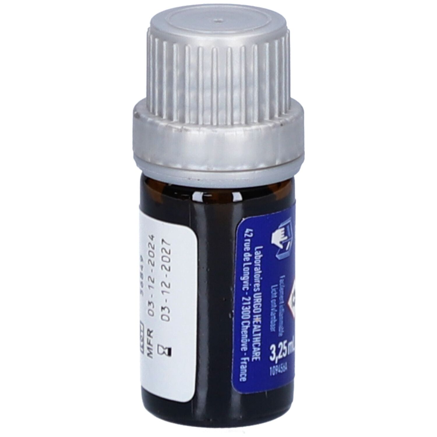 Braune Glasflasche mit silbernem Deckel. Blaues Etikett mit Text: URGO, 3,25 ml, Haltbarkeit bis 03-12-2027.