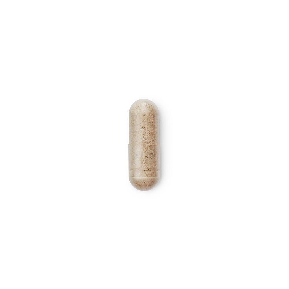 Enkele Heliocare 360° D Plus capsule. Beige, langwerpig. Witte achtergrond.