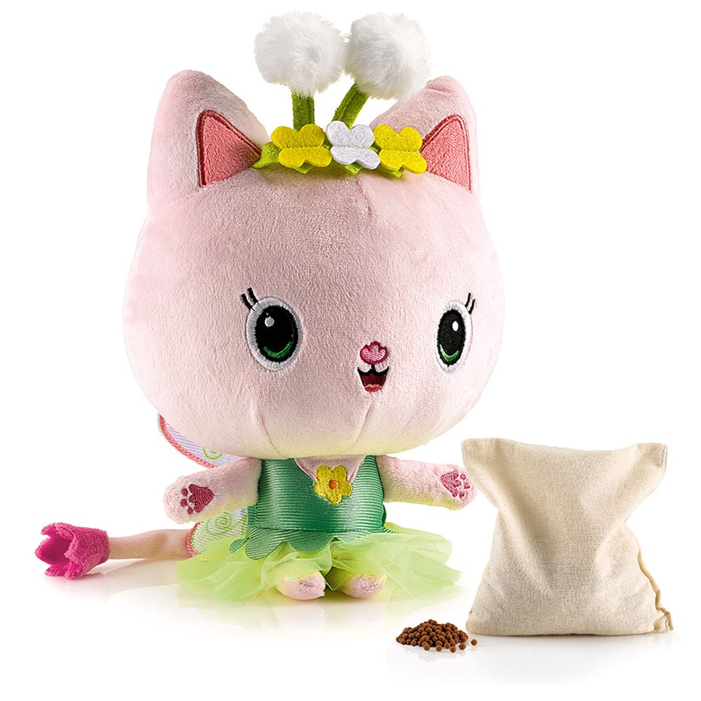 Plüschkatze mit Blumenkranz und Flügeln, daneben ein Beutel mit Granulat.