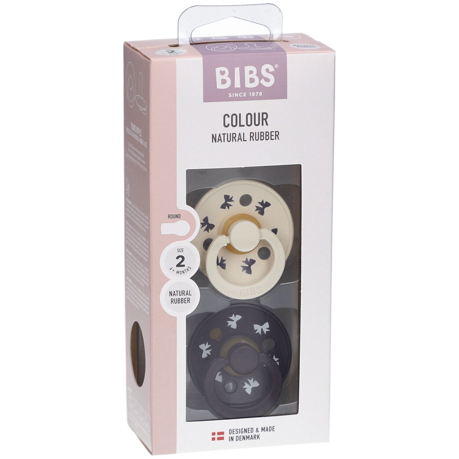 Verpackung mit zwei Schnullern. Sichtbar: cremefarbener und dunkelblauer Schnuller mit Muster. Marke BIBS.