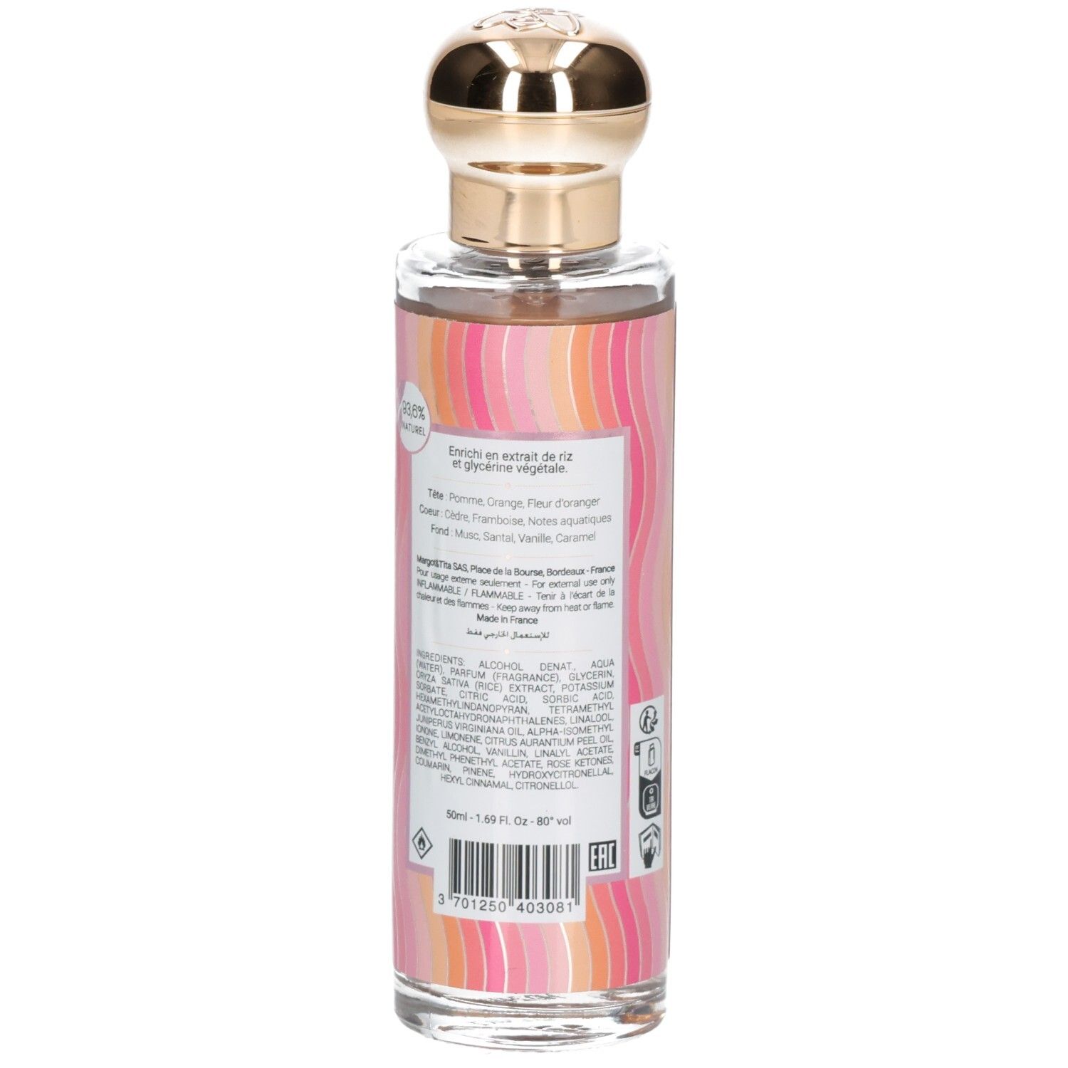 Flacon en verre avec bouchon doré, rempli d'eau parfumée. Emballage coloré et rayé.