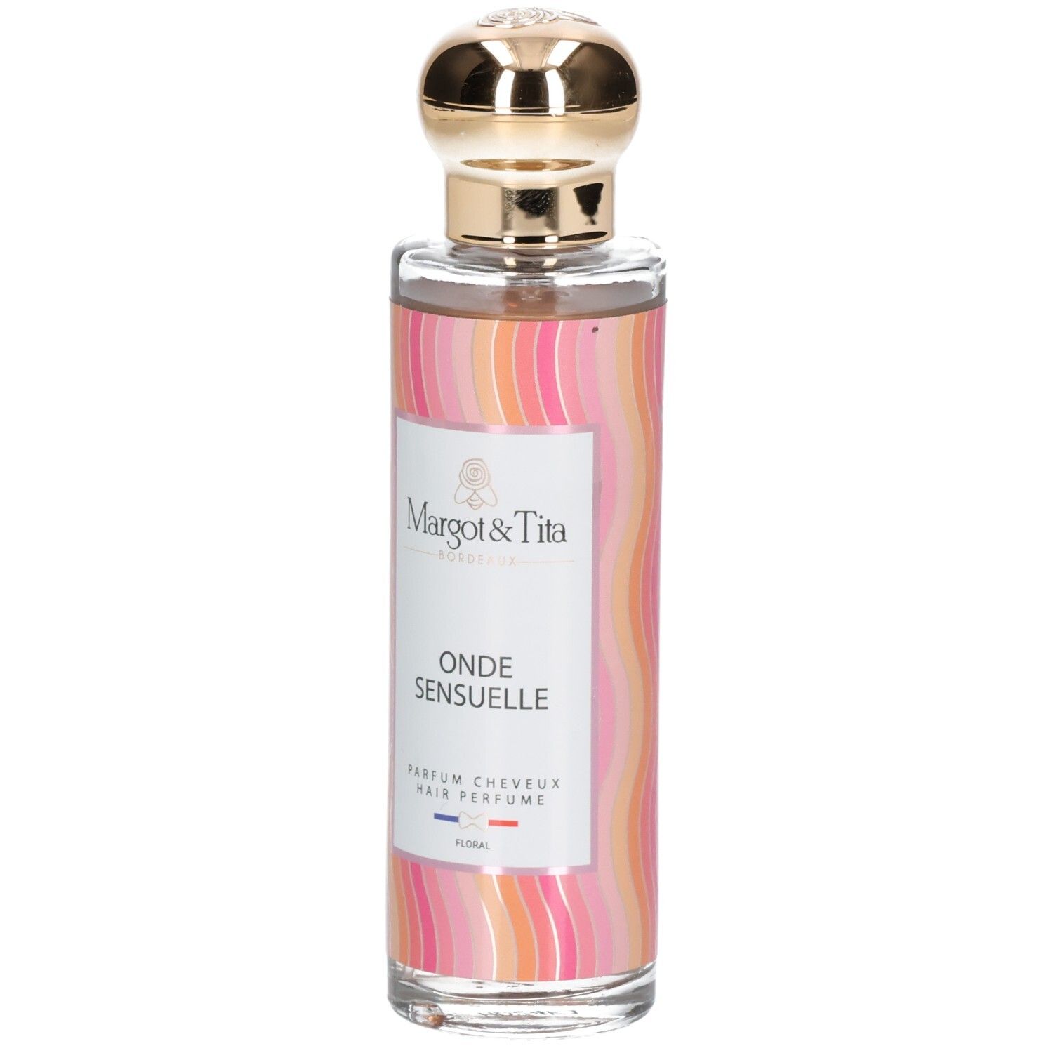 Parfum pour cheveux en flacon de verre avec bouchon doré. Étiquette avec logo Margot & Tita, "ONDE SENSUELLE" et "PARFUM CHEVEUX". Motif ondulé coloré.