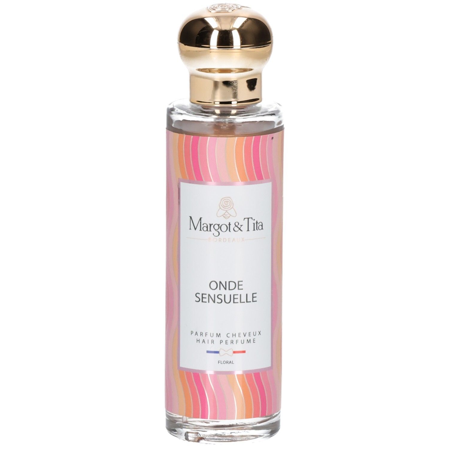 Flacon de parfum capillaire avec bouchon doré et étiquette florale.