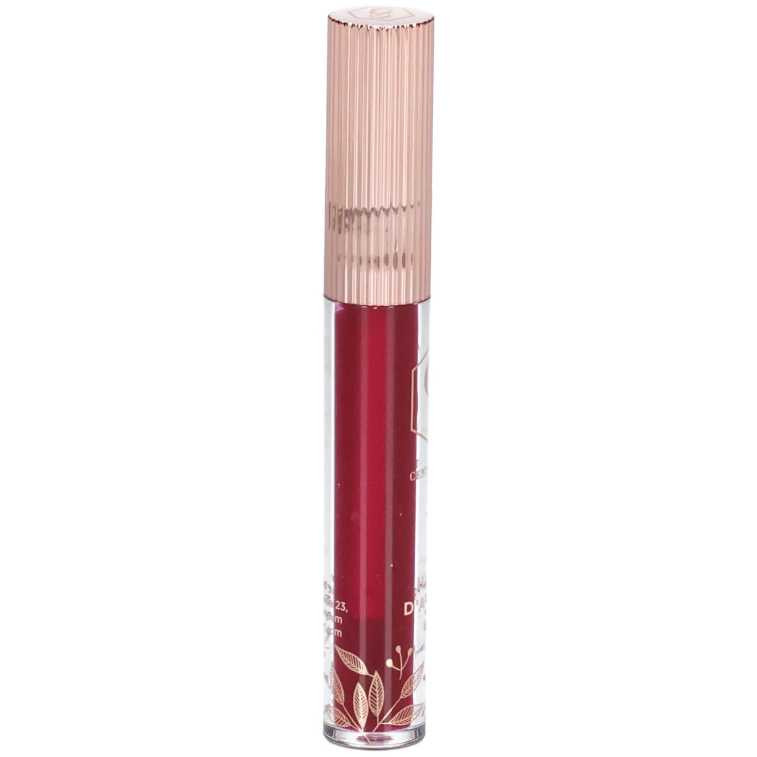 Lippenöl in einer transparenten Flasche mit roségoldfarbenem Deckel. Der Inhalt ist rot. Auf der Flasche sind goldene Verzierungen zu sehen.