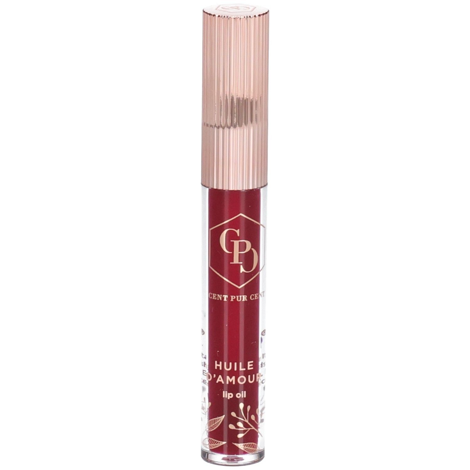 Lippenöl in einer transparenten Flasche mit roségoldfarbenem Deckel. Der Inhalt ist rot. Auf der Flasche sind goldene Verzierungen zu sehen.