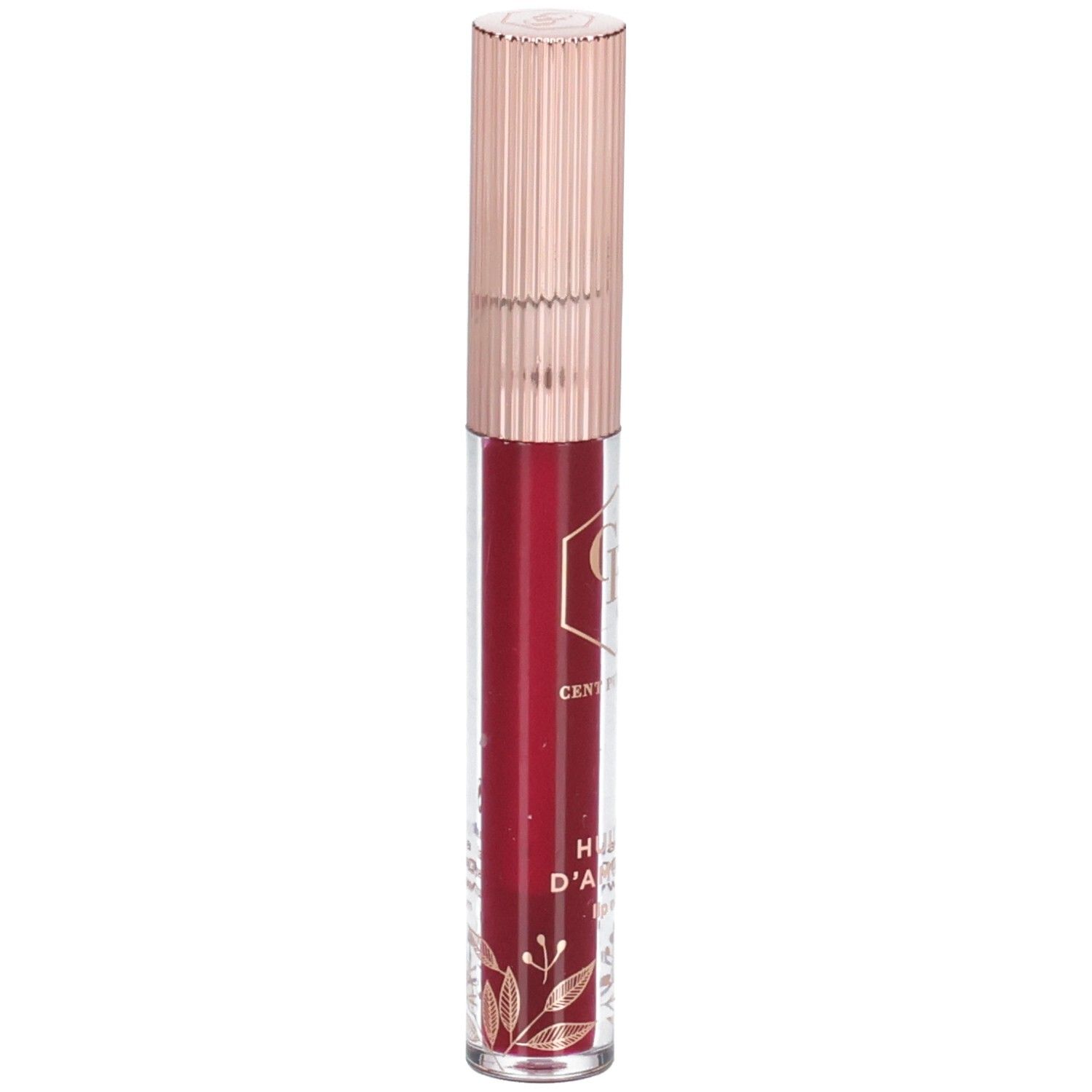 Lippenöl in einer transparenten Flasche mit roségoldfarbenem Deckel. Der Inhalt ist rot. Auf der Flasche sind goldene Verzierungen zu sehen.