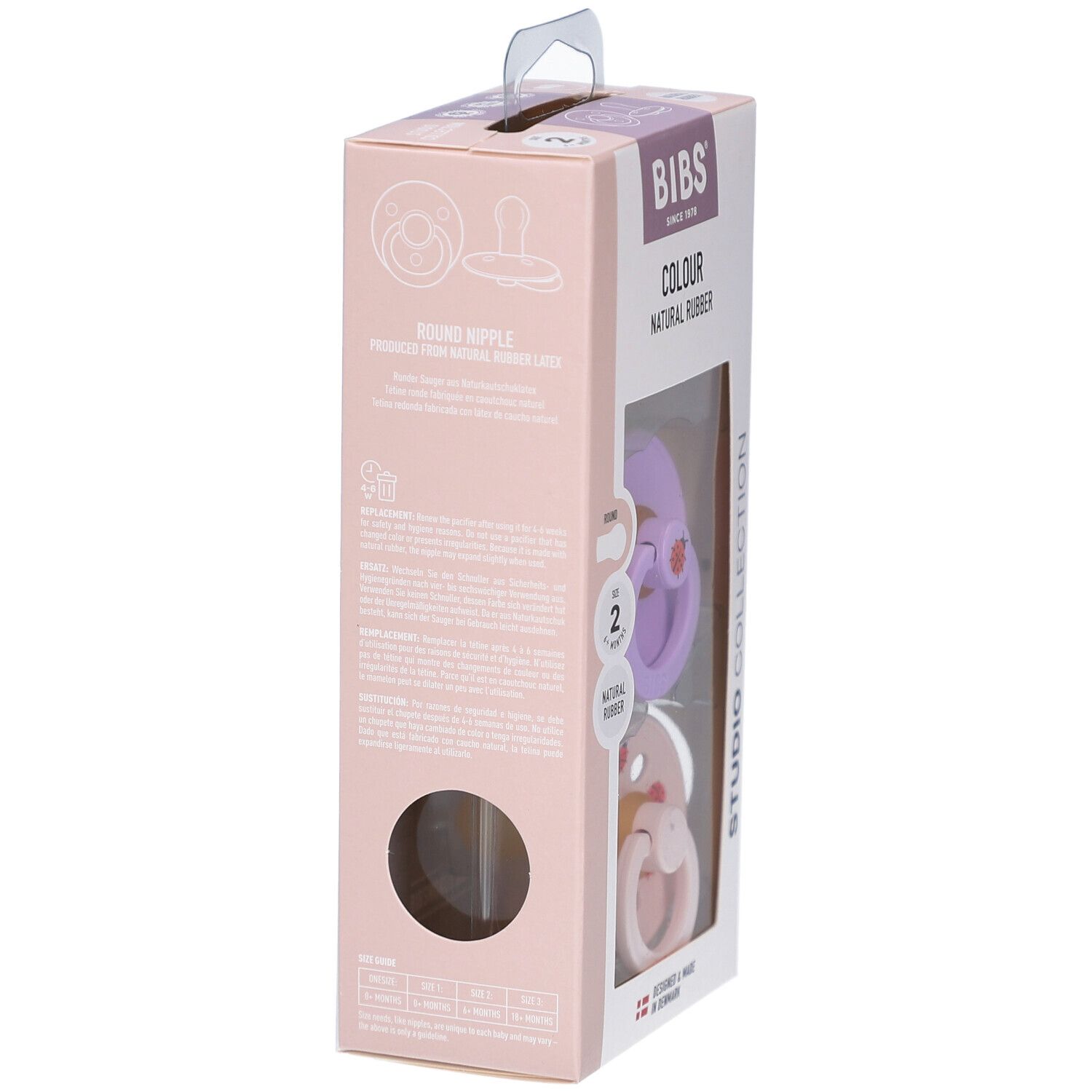 Verpackung mit zwei Schnullern. Lila und rosa Sauger mit Marienkäfer-Motiv. Naturgummi. BIBS-Marke.