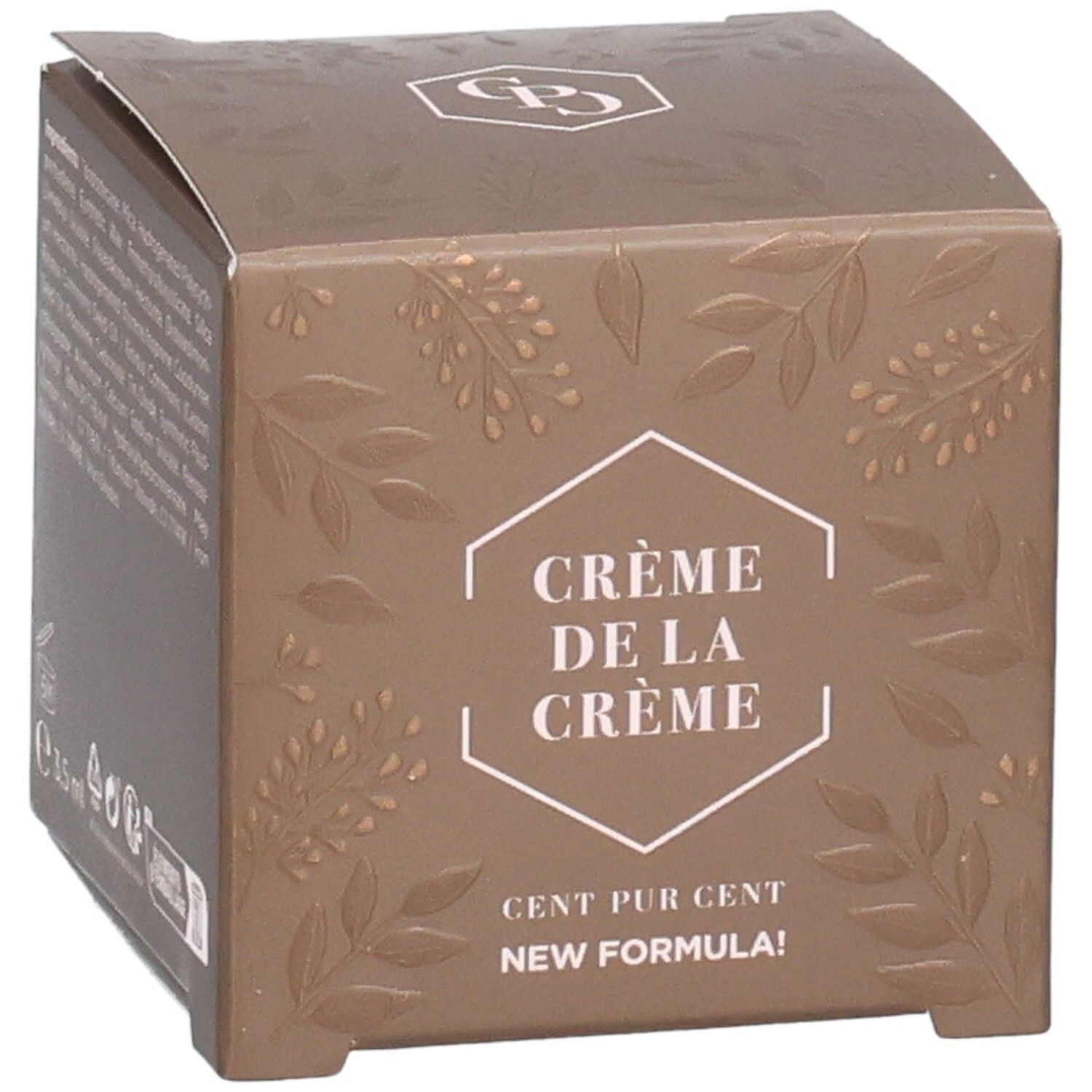 Braune Verpackung mit Text und geprägten Blättern. Text: Crème de la Crème, Cent Pur Cent, New Formula. Logo oben.