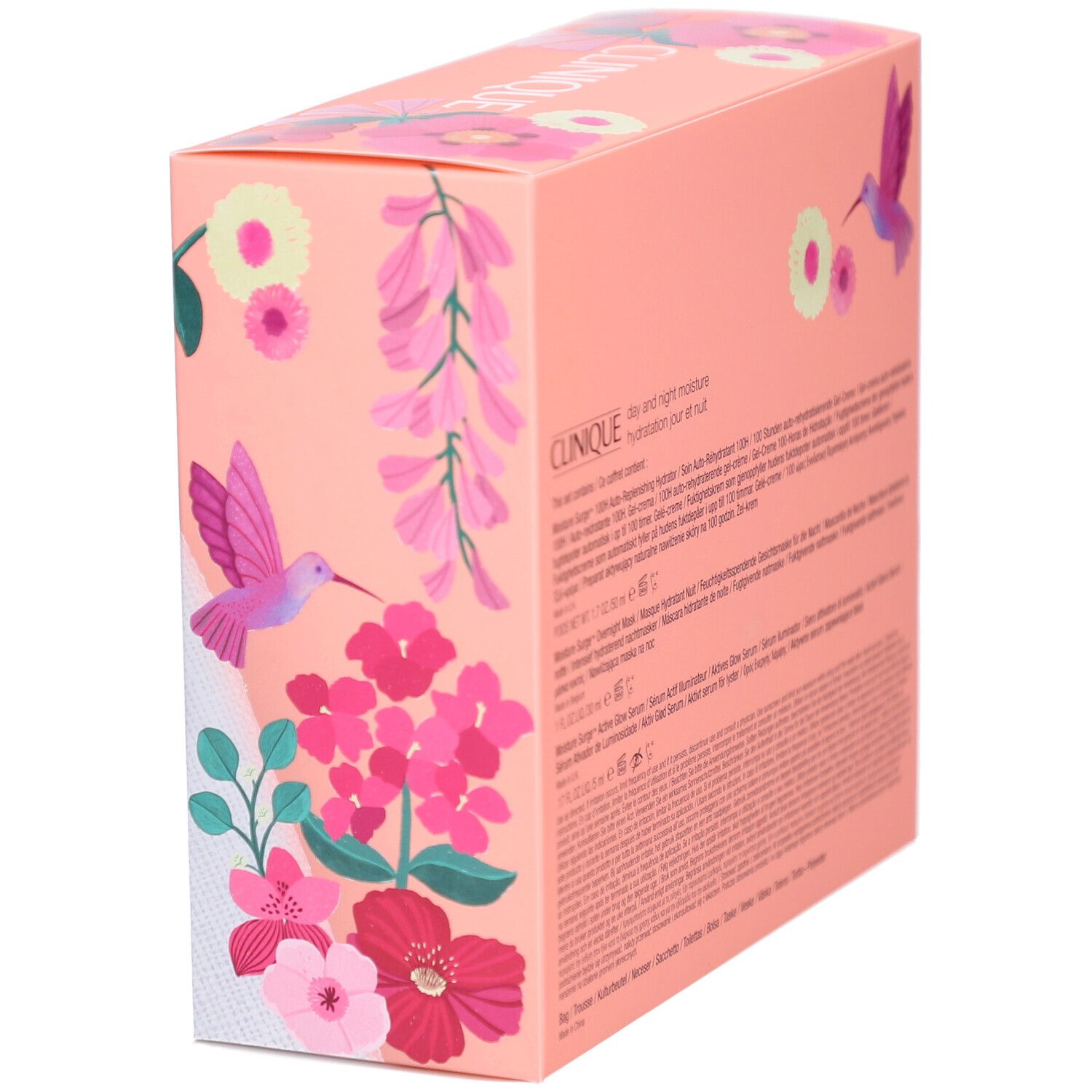 Geschenkbox mit Clinique-Produkten. Rosa Verpackung mit Blumen und Vogel. Text auf der Verpackung.