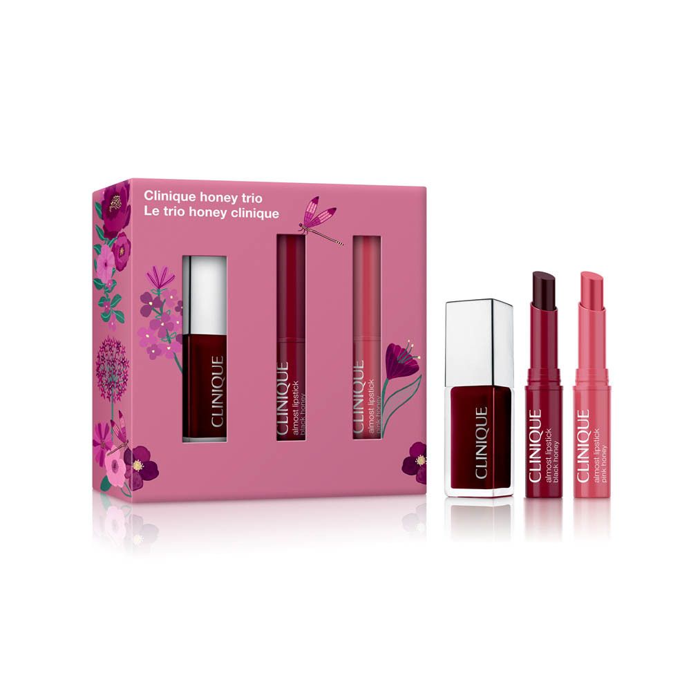 Clinique Lippenstift-Set mit drei Lippenstiften in Rot- und Rosatönen in einer floral verzierten Geschenkbox.