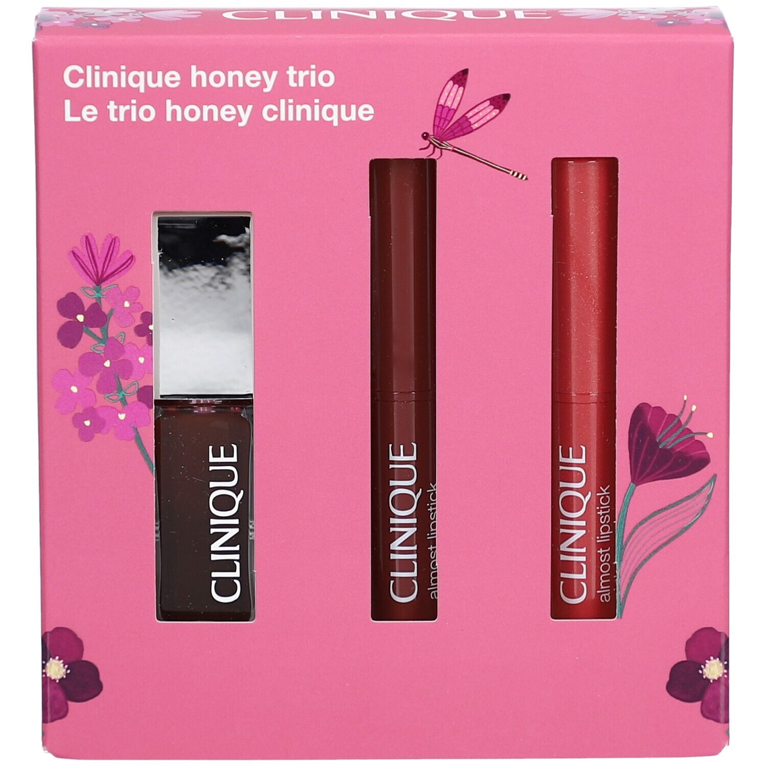 Rosa Geschenkbox mit drei Kosmetikprodukten. Produkte: Lipgloss und zwei Lippenstifte. Auf der Box steht "Clinique honey trio".