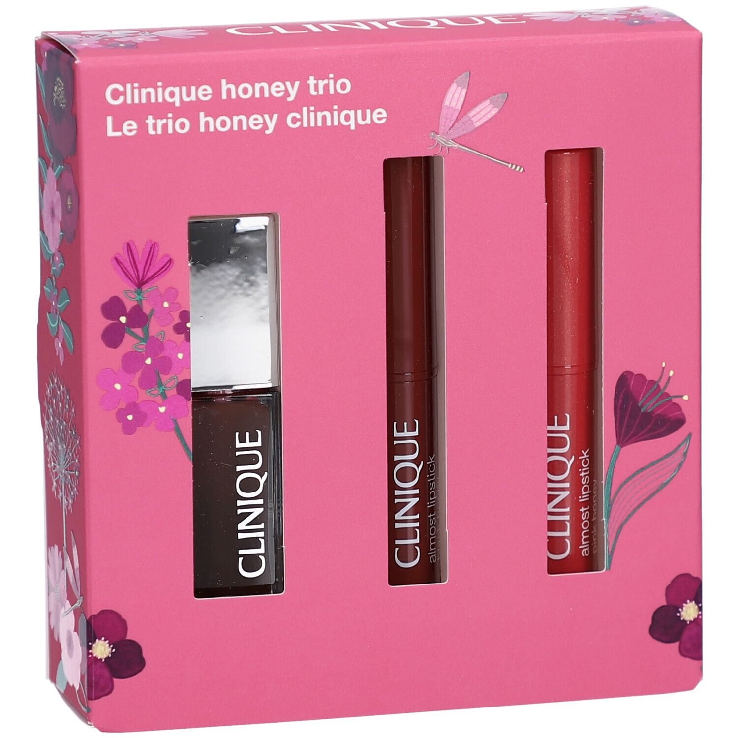 Rosa Geschenkbox mit drei Kosmetikprodukten. Produkte: Lipgloss und zwei Lippenstifte. Auf der Box steht "Clinique honey trio".