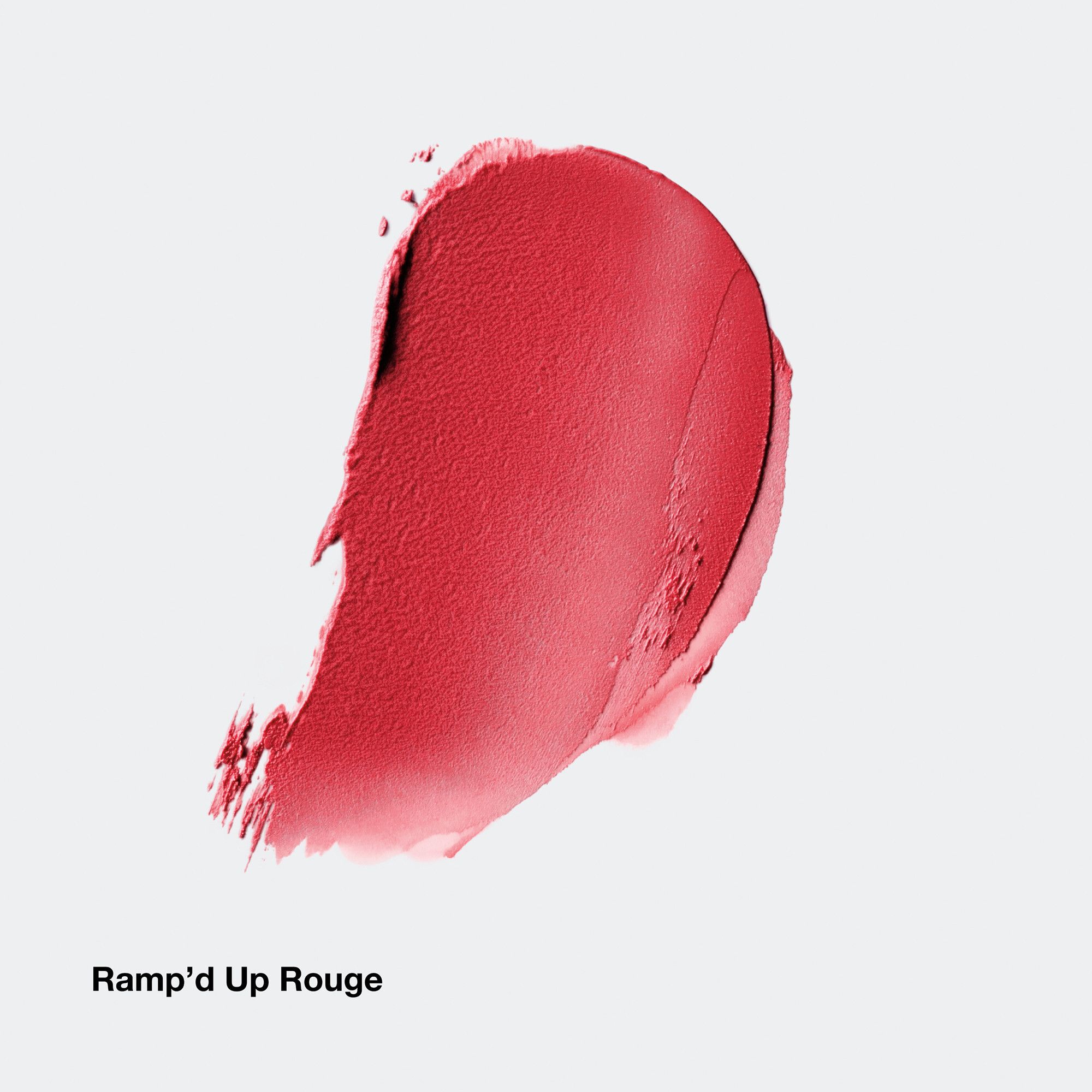Roter Farbklecks von Clinique. Produktname 'Ramp'd Up Rouge' sichtbar.
