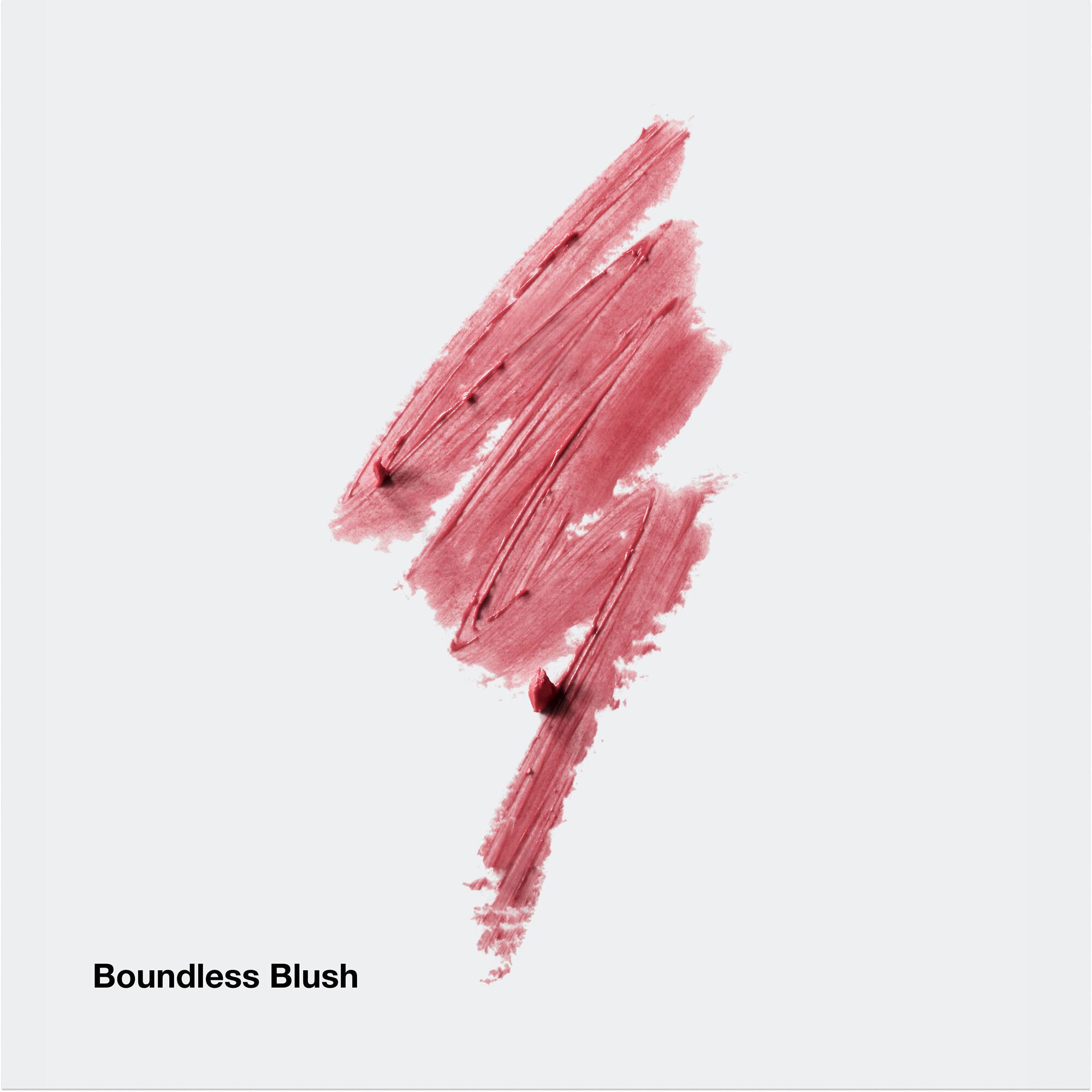Rosa Lippenstift-Abstrich. Text: Boundless Blush. Helle, neutrale Hintergrundfarbe.