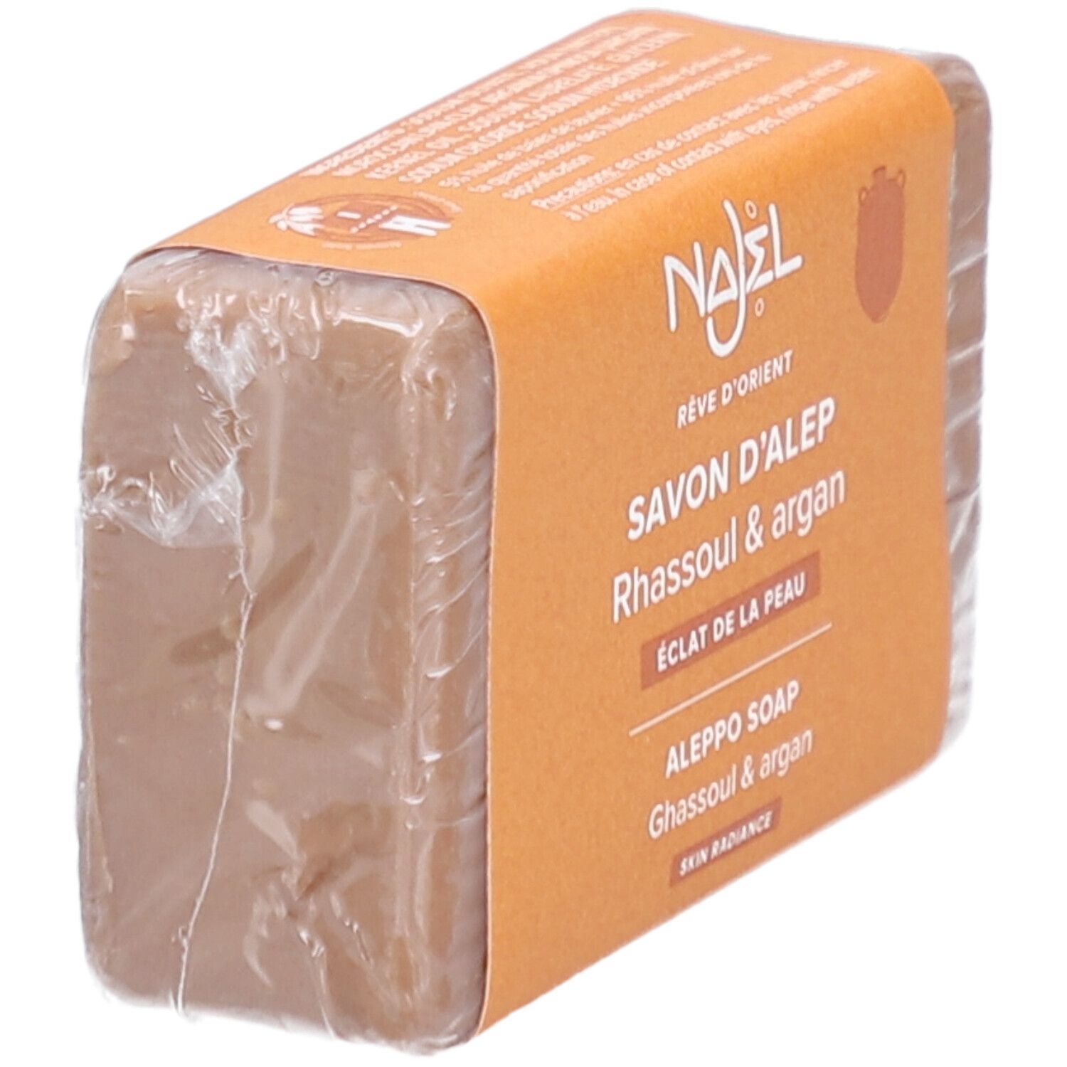 Rechteckige Seife in Folie. Orangefarbene Banderole mit Produktnamen und Logo.