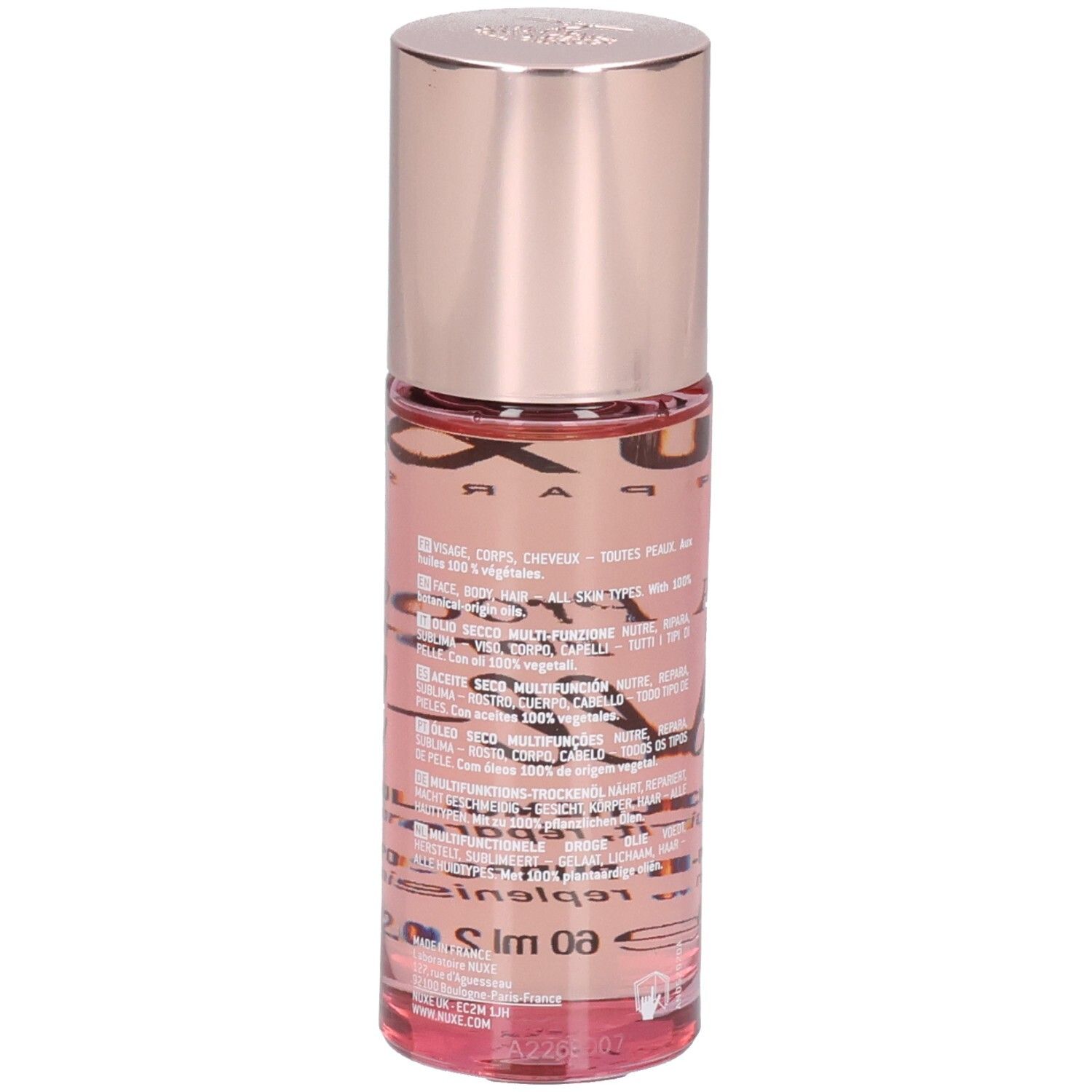 Nuxe Huile Prodigieuse Florale Roll-On: Rückseite der Glasflasche mit rosa Öl, roségoldfarbenem Deckel und Text.