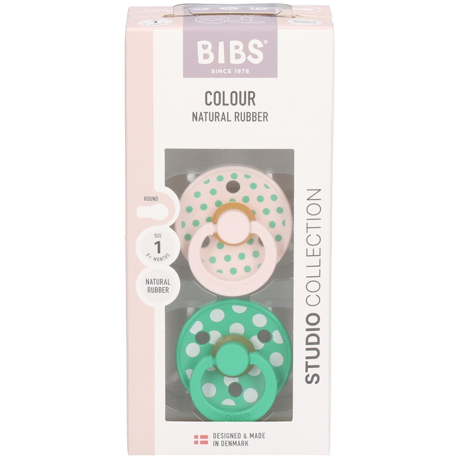 Verpackung mit zwei Schnullern. Rosa und grüne Schnuller mit weißen Punkten. Marke: BIBS. Naturgummi.