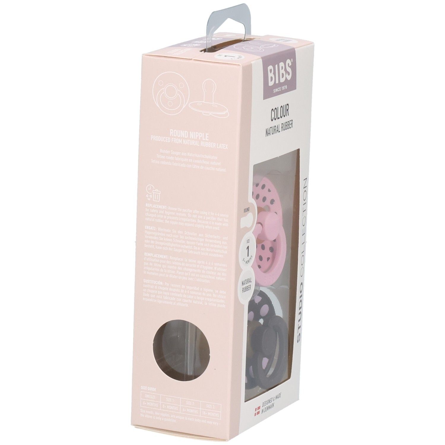 Verpackung mit zwei Schnullern. Rosa und braun mit weißen Punkten. Marke: BIBS. Sichtfenster.