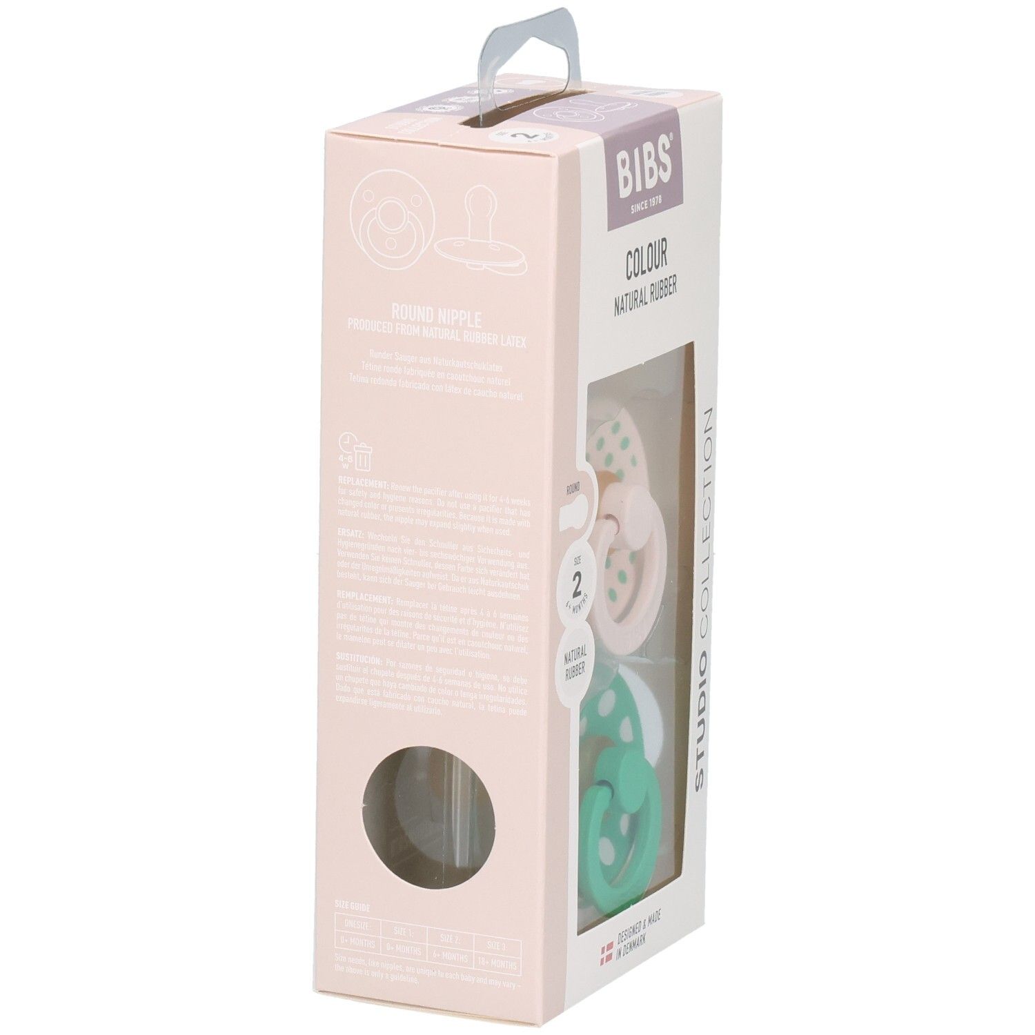 Verpackung mit zwei Schnullern. Rosa und grüne Schnuller mit weißen Punkten. Marke: BIBS. Naturgummi.