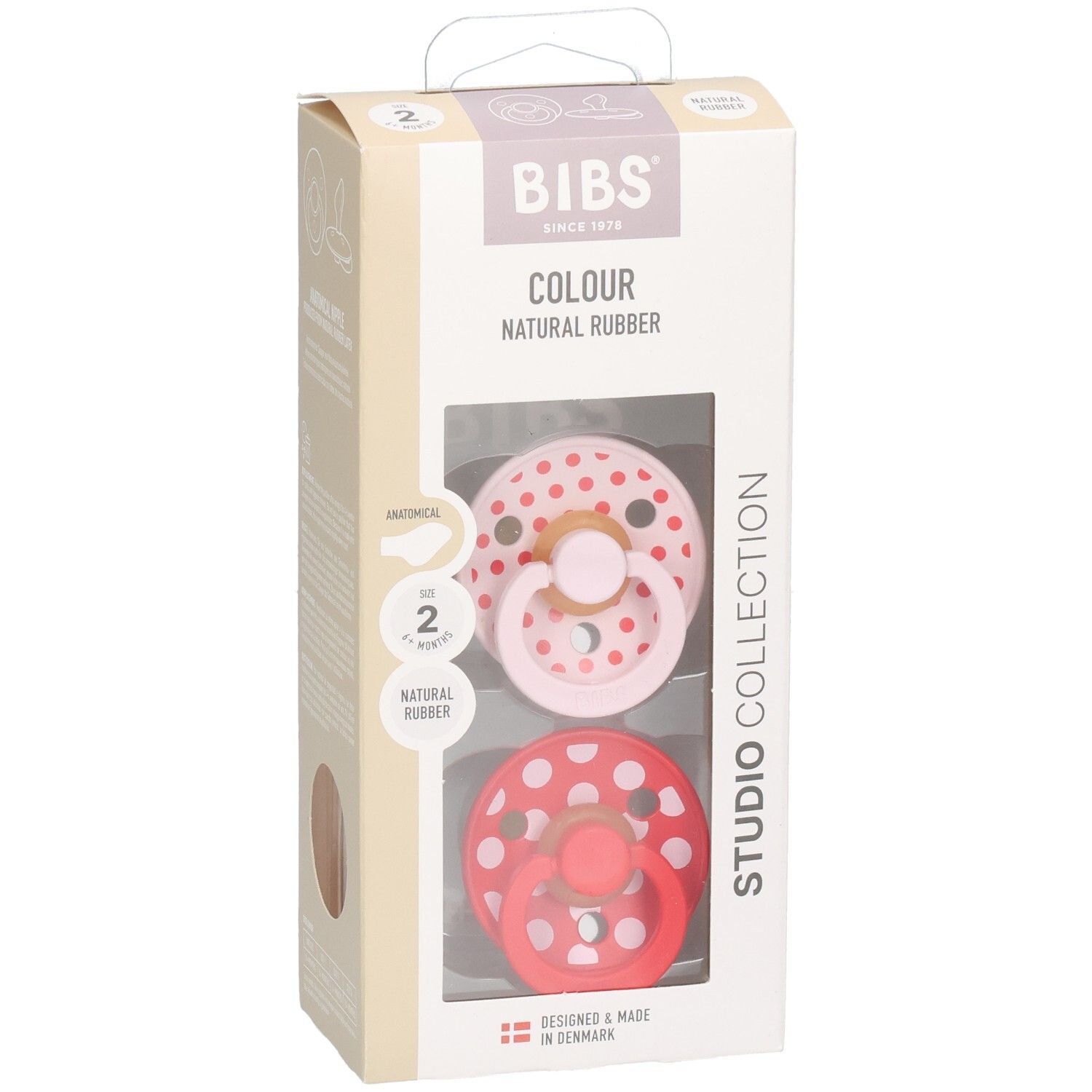 Verpackung mit zwei Schnullern. Rosa und roter Schnuller mit weißen Punkten. BIBS-Logo und Produktinformationen.
