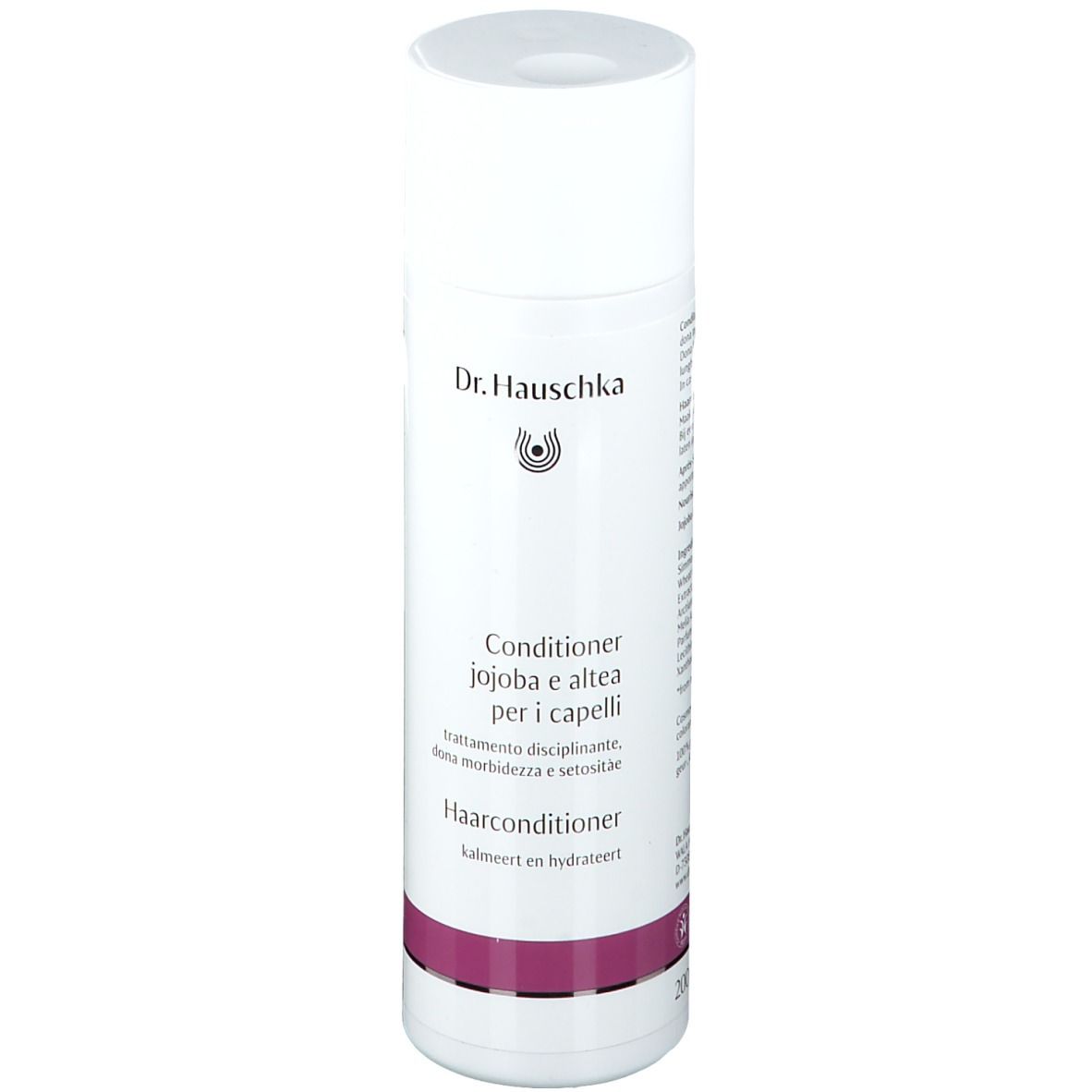 Flacon blanc et violet. Inscription : Dr. Hauschka, Après-shampooing, Jojoba et guimauve pour cheveux.