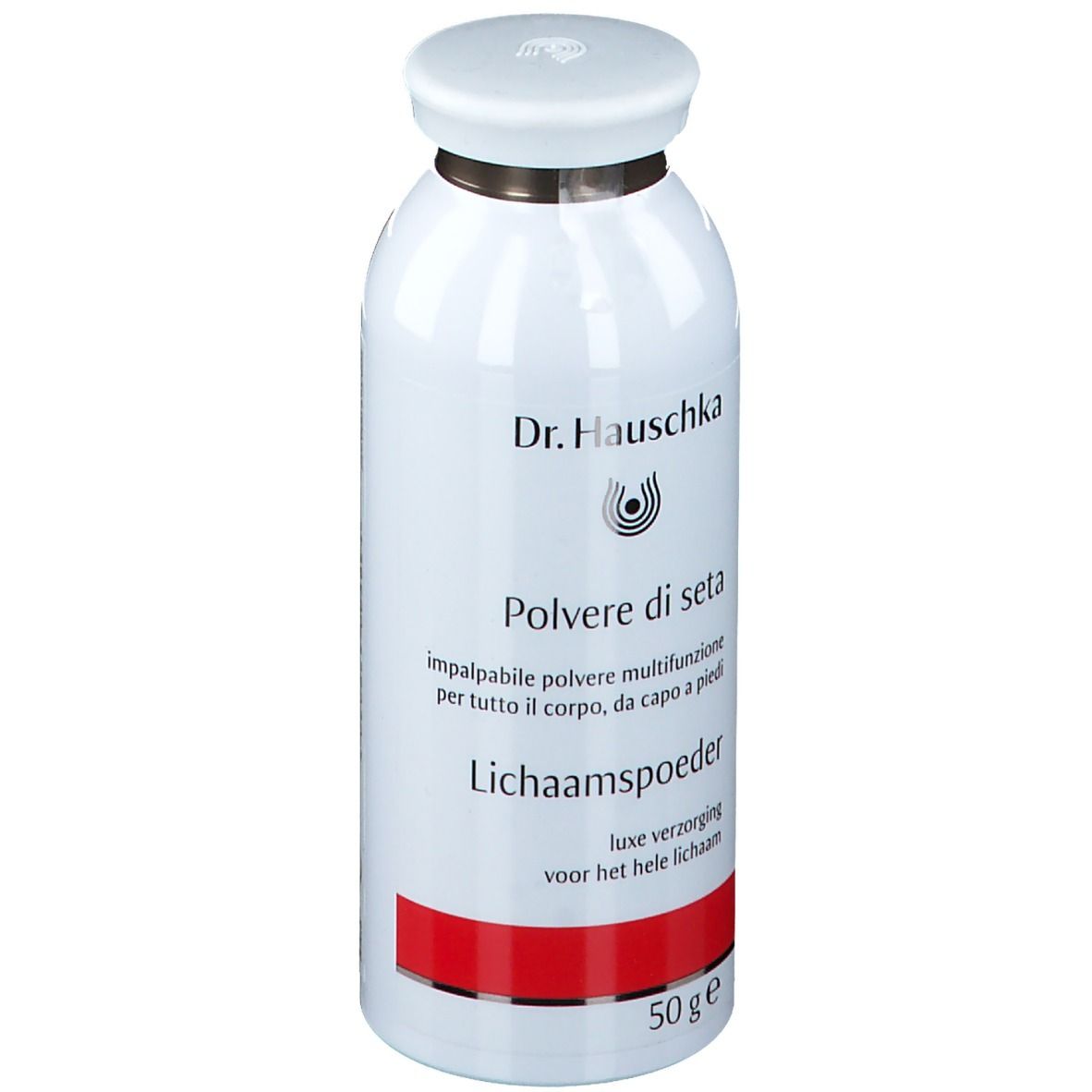 Weiße Dose mit Deckel. Aufschrift: Dr. Hauschka, Poudre de Corps, 50 g. Roter Streifen am Boden.