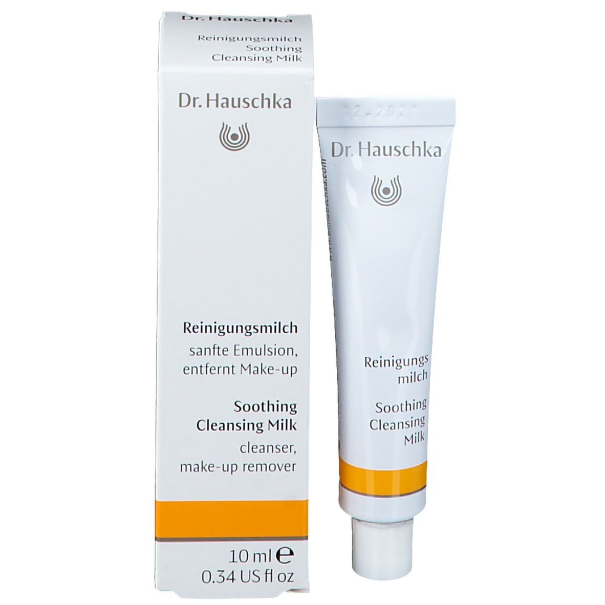 Emballage produit avec tube. Inscription: Dr. Hauschka, Lait Démaquillant, 10 ml. Tube et emballage blancs avec accents jaunes.